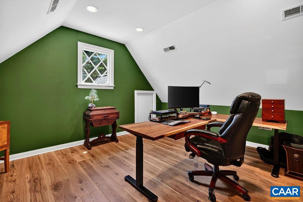 The spacious office above the primary suite was renovated in the last year.