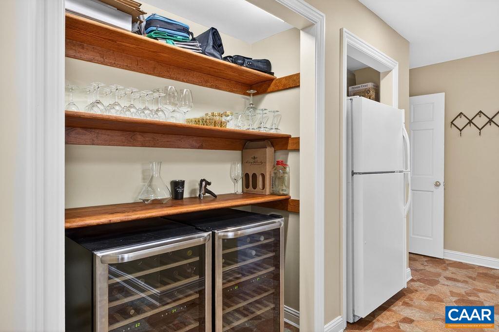 An exceptional storage area, butler’s pantry, and mudroom connect the kitchen to the garage