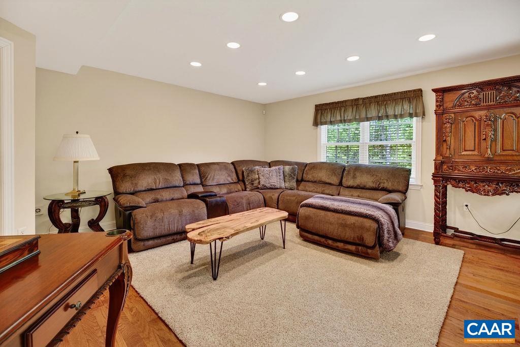 A great size lower level family room with a gas-logs fireplace.