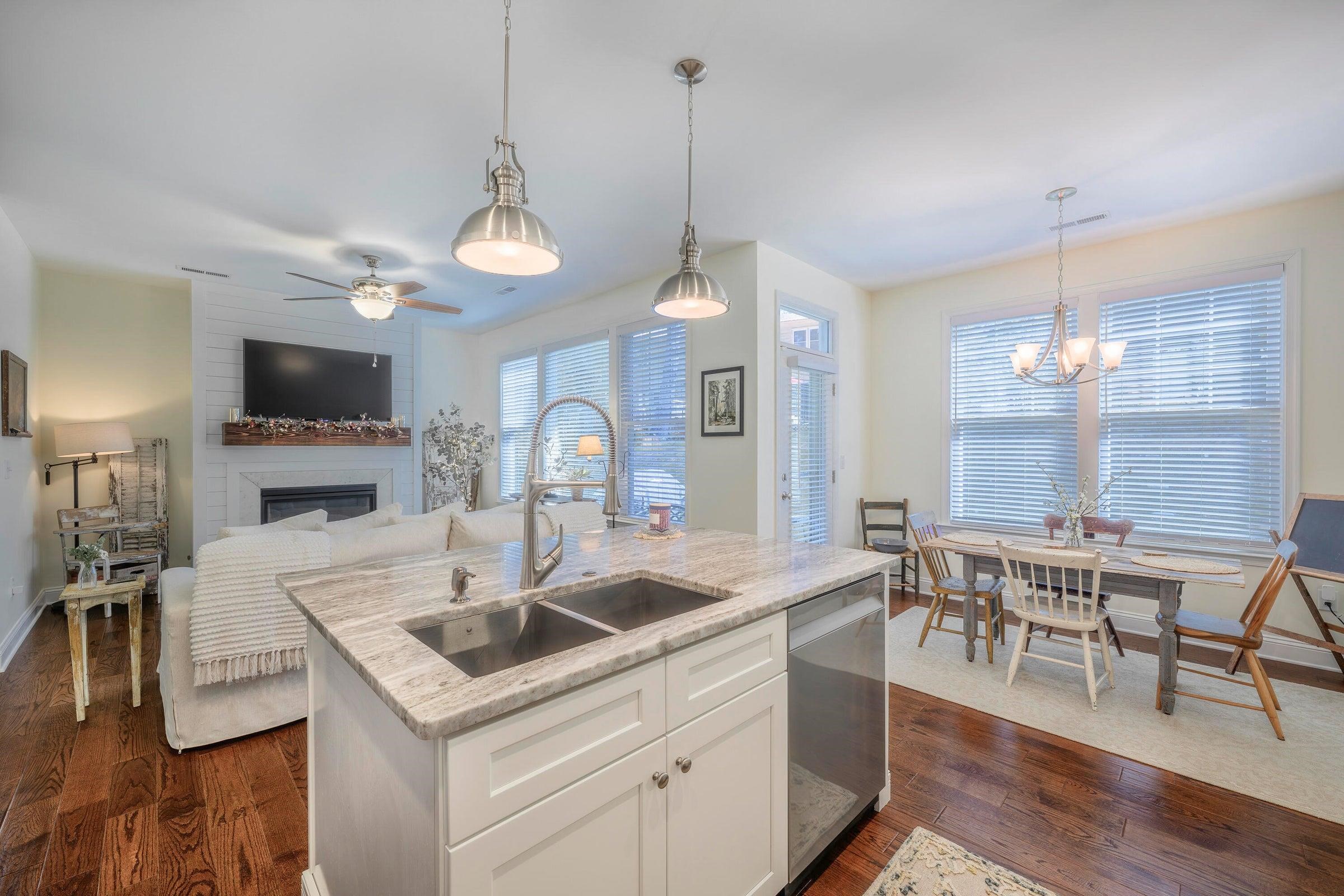 There is a seamless flow between the kitchen, dining, and living areas.