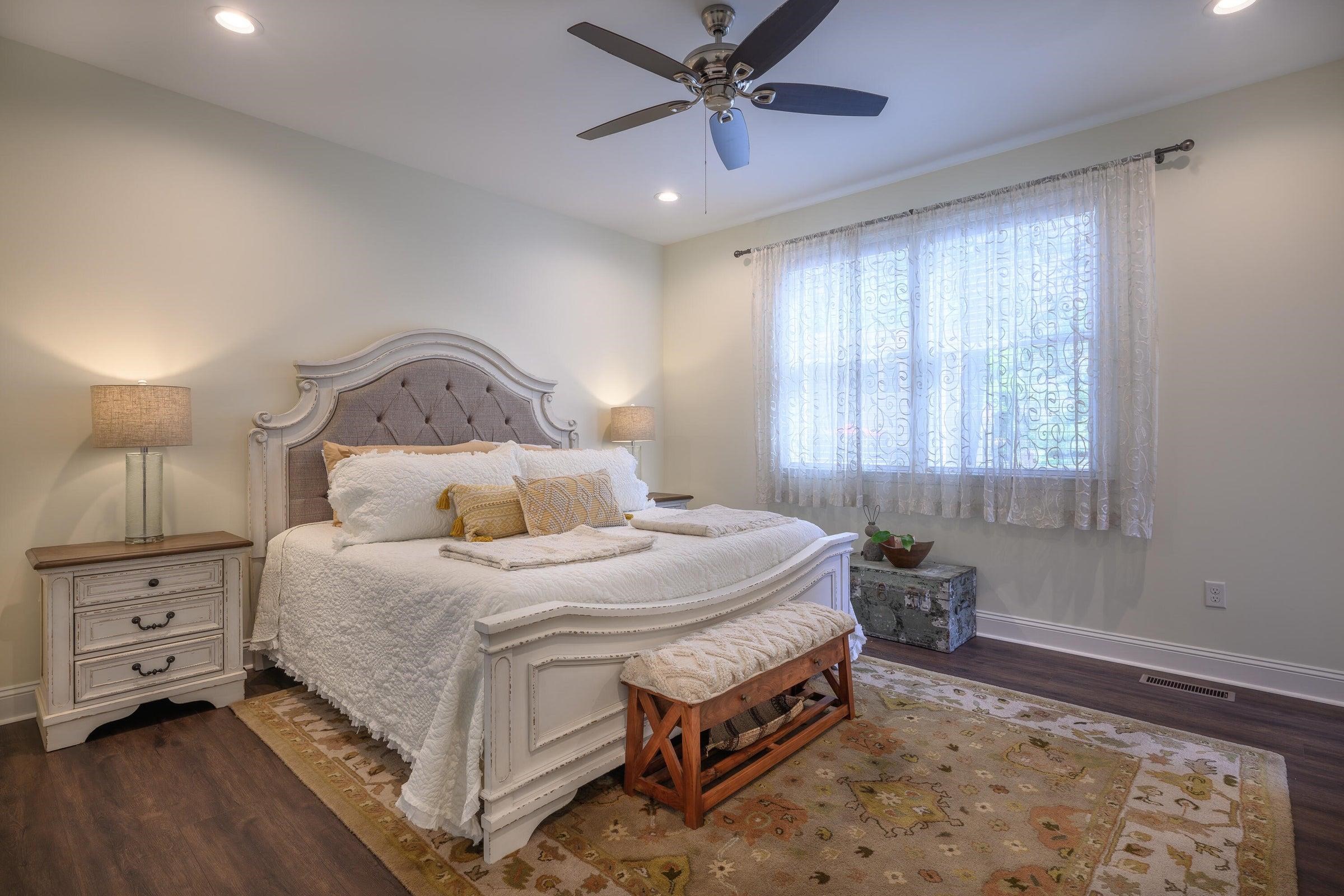 Upstairs, the primary suite includes a walk-in closet and a second closet for additional storage.