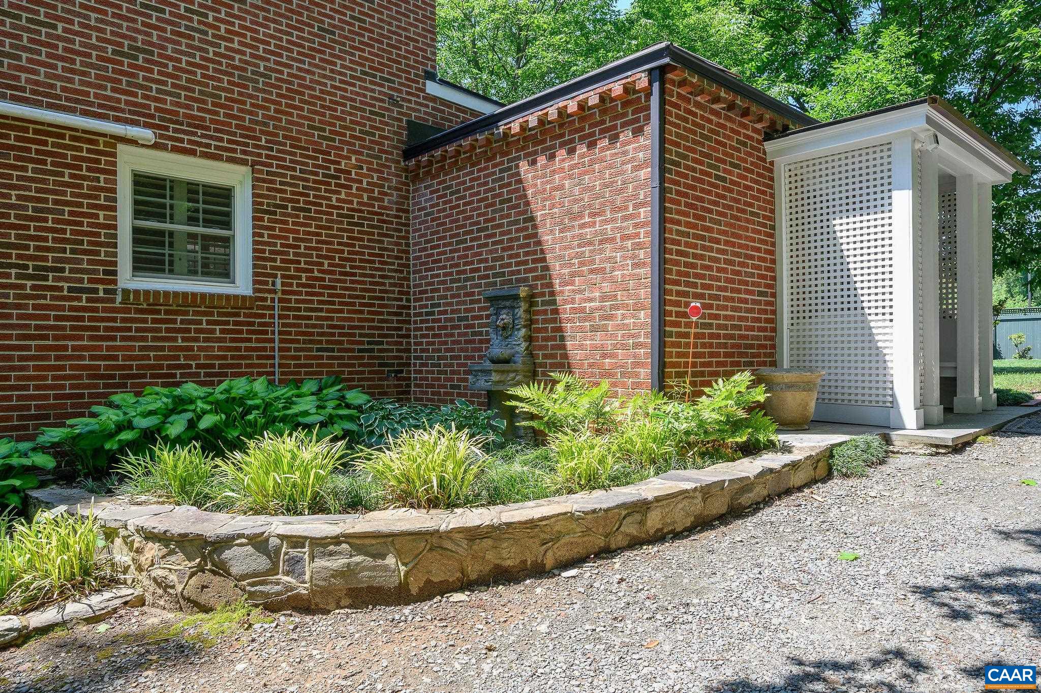Side entrance to mudroom and laundry that opens to kitchen.