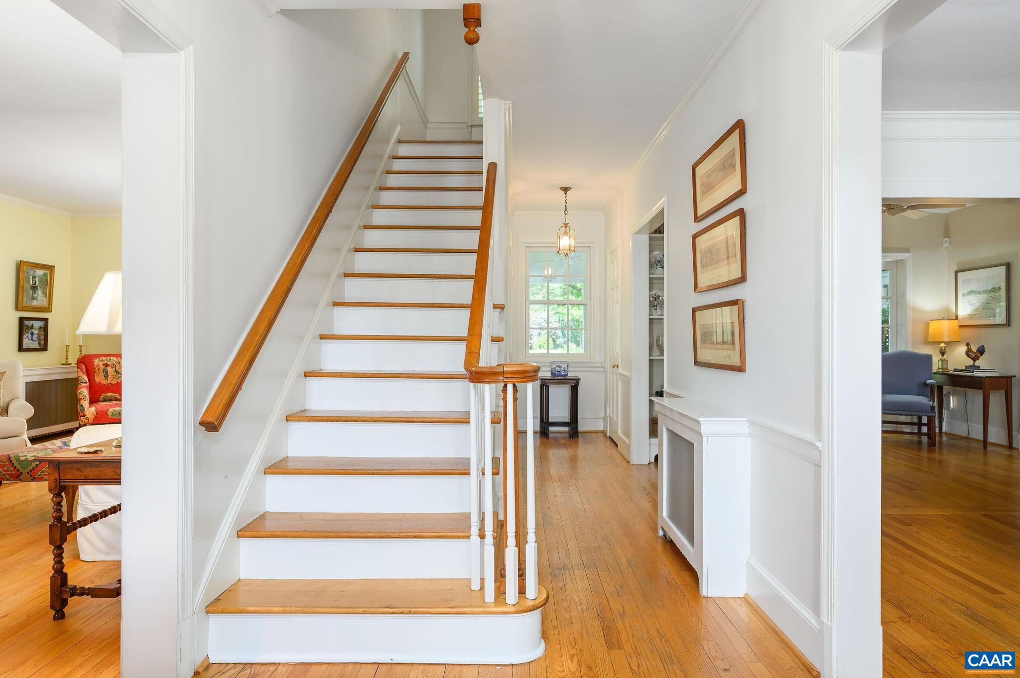 Front foyer looks to rear and opens to living room and dining room.