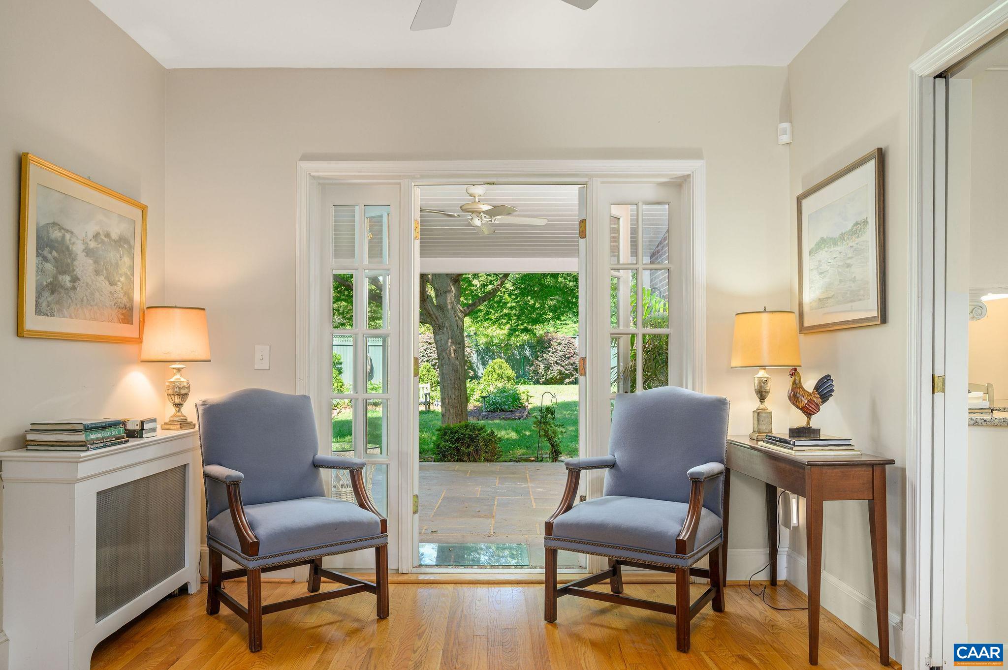 French doors off all first floor rooms lead to the covered veranda and spectacular rear yard.