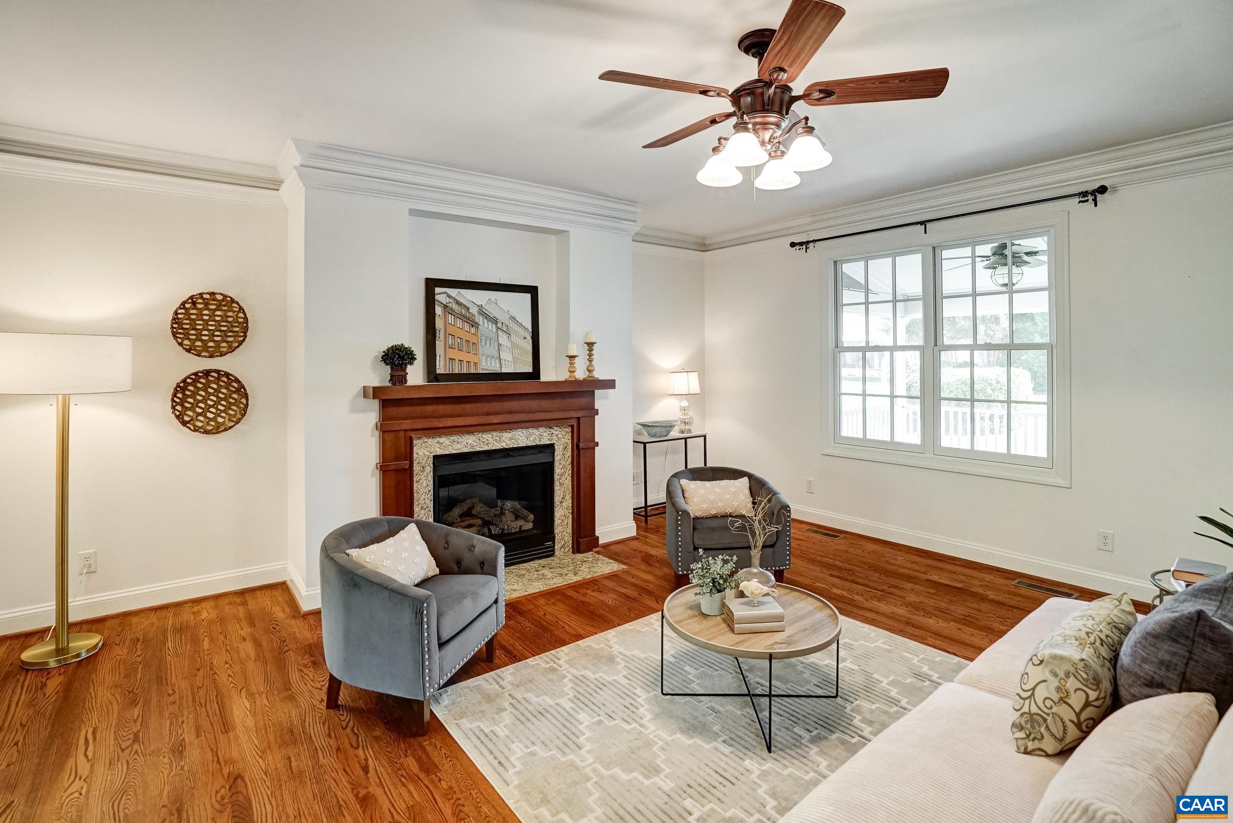 Crown moulding details and beautiful mantel with granite surround.