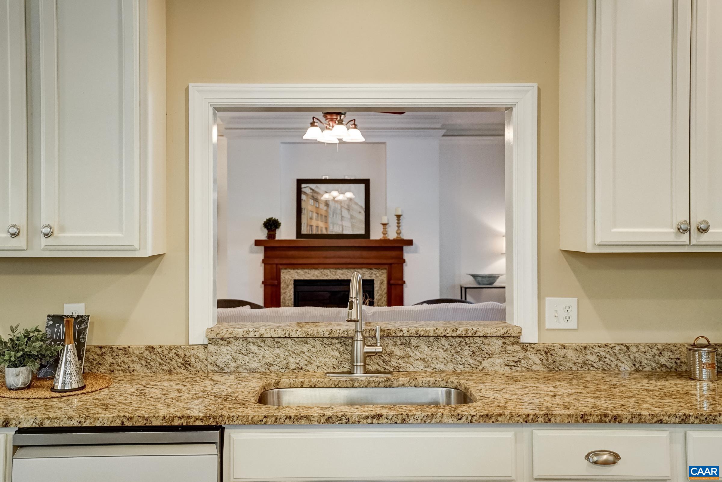 Pass through above sink opens into living room.