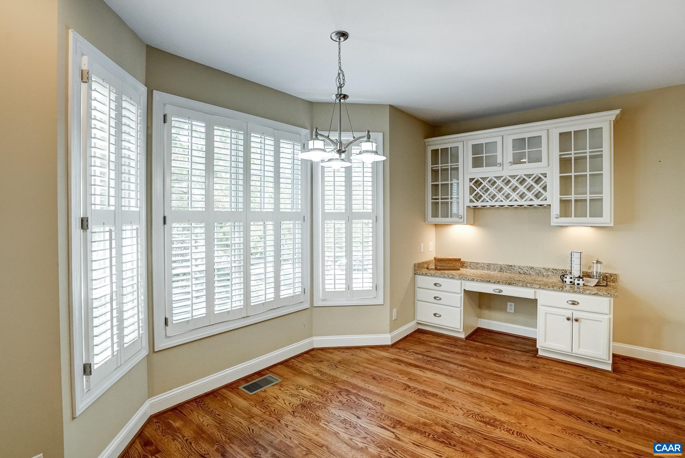 Eat in Breakfast nook feautres white shutters and wine bar.