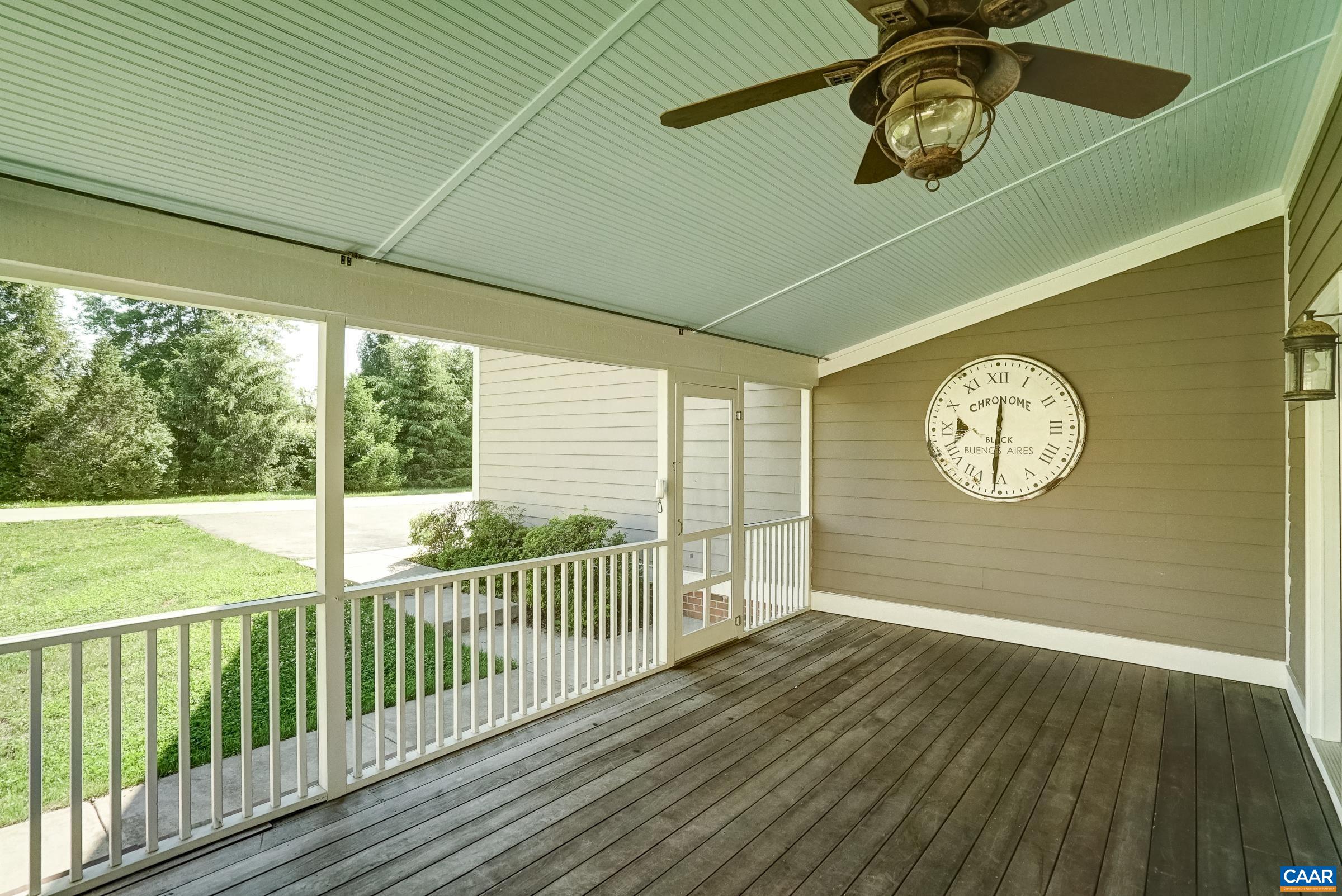 Screened porch with mahogany decking is the perfect spot to enjoy the outdoors.