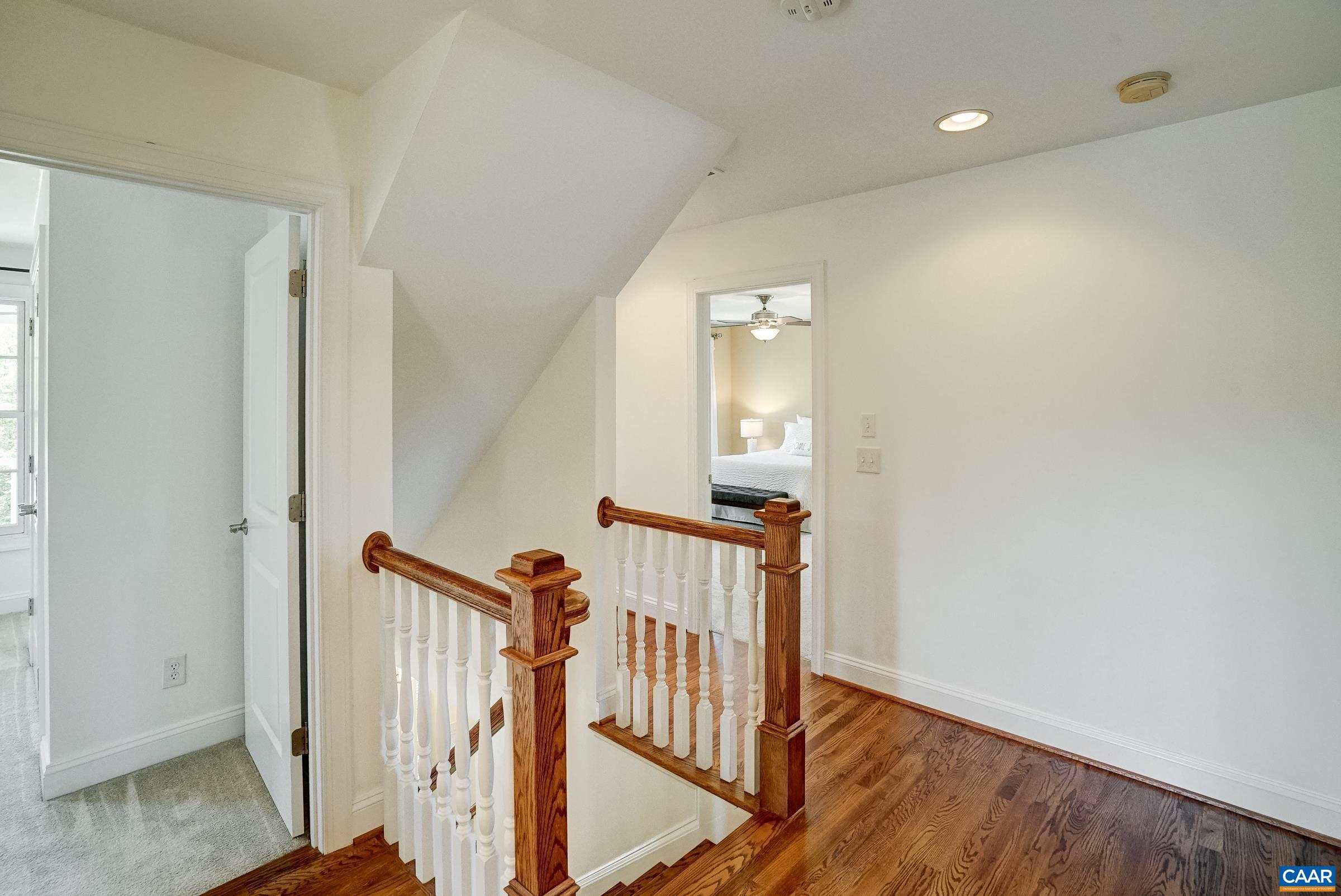 Second floor with hardwoods in hallway.