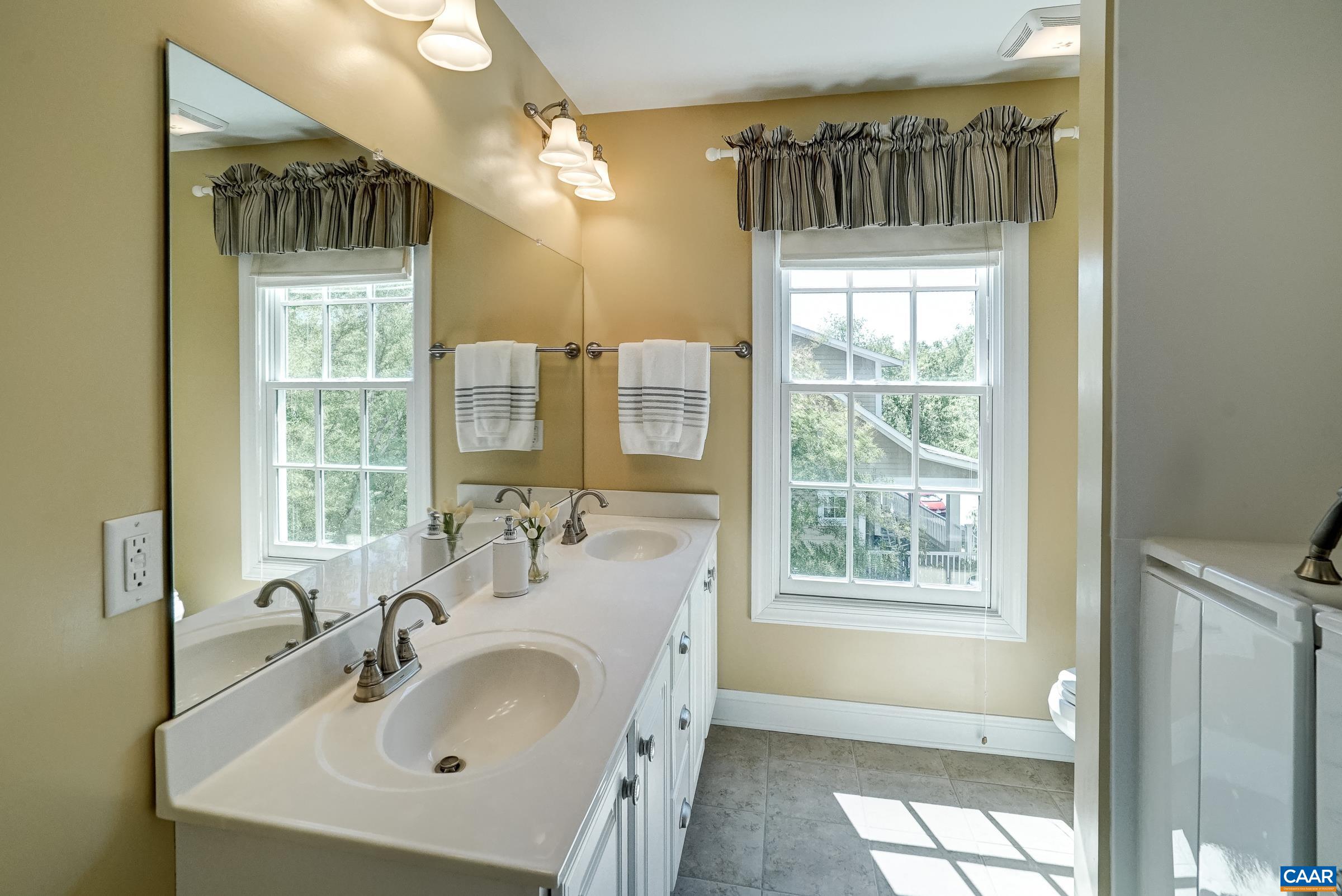 Full hall bathroom with walk-in tub.