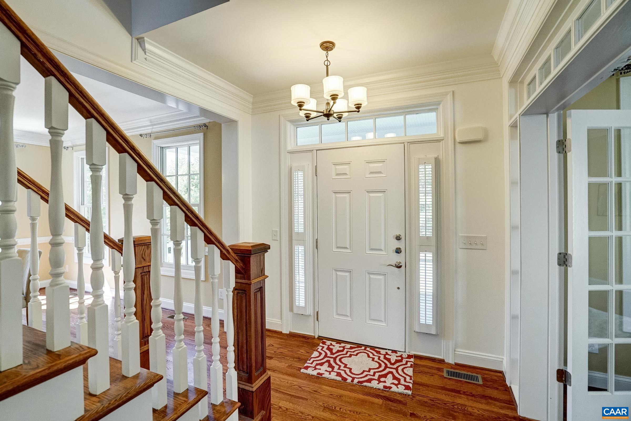 Welcoming foyer with sidelights on the front door.