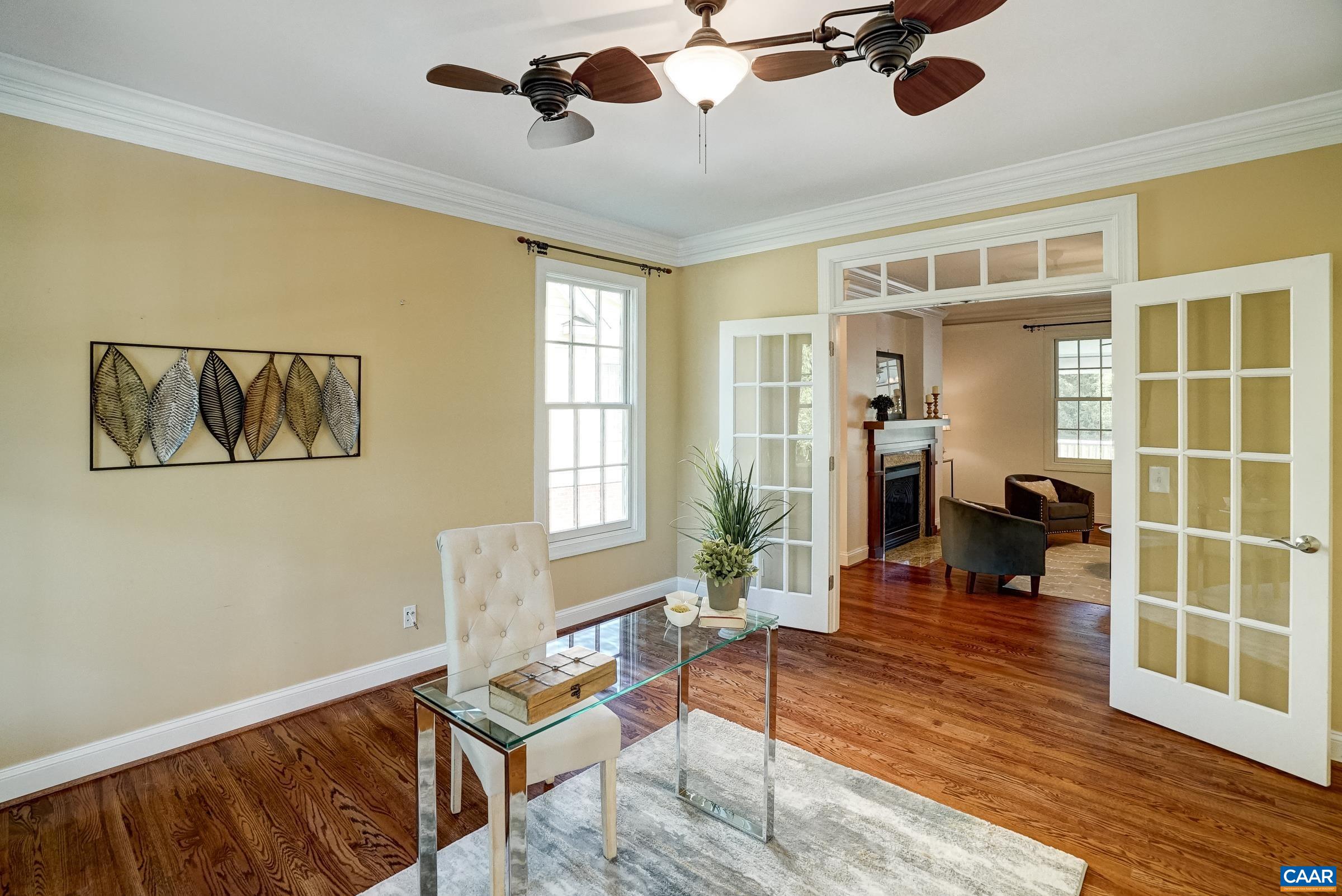 Unique two blade fan in the office.  This room could also be a formal living room or playroom.