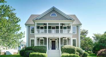 Beautiful traditional home overlooking the green common area in a quiet section of Old Trail.