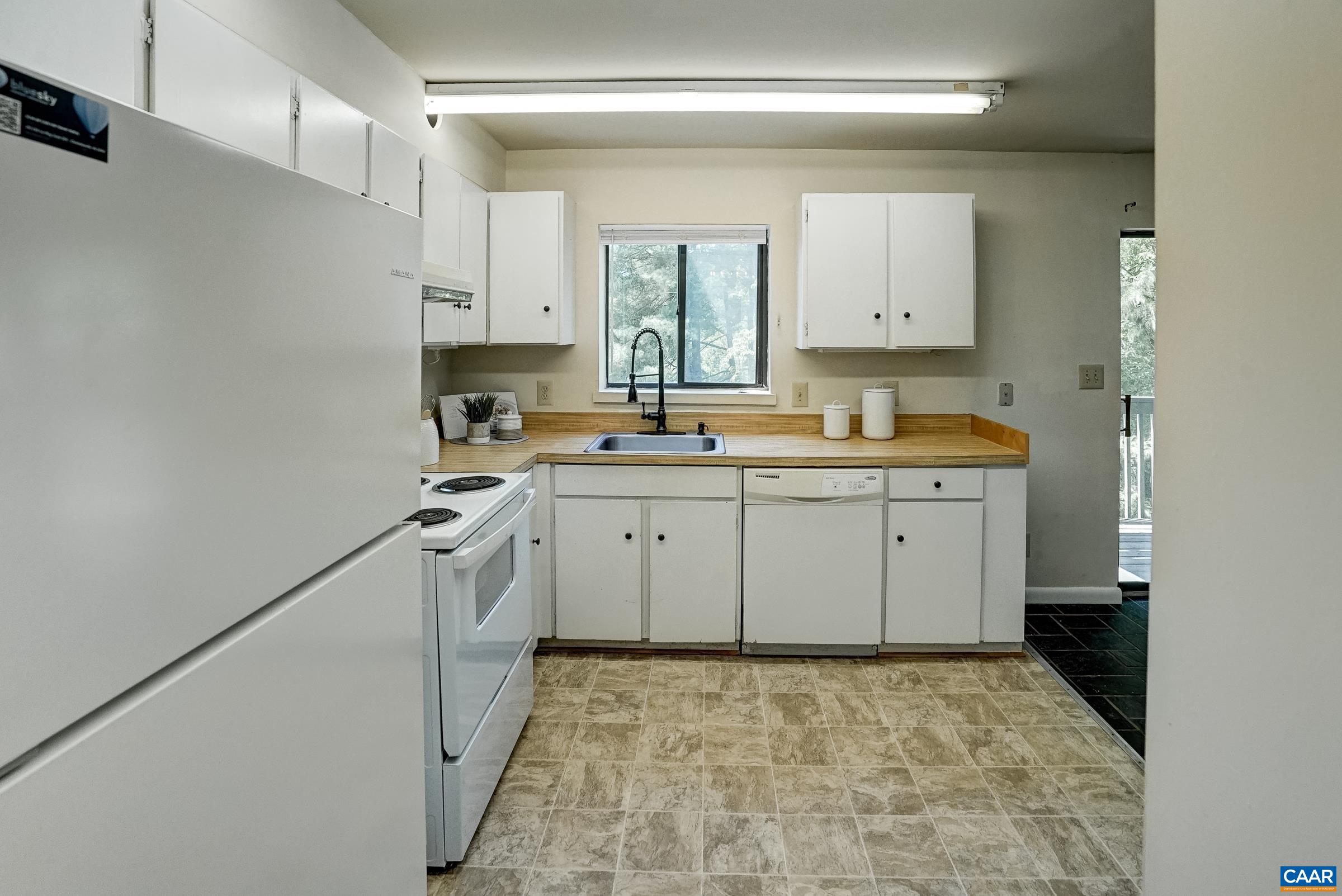 Functional kitchen features an updated refrigerator (2018)