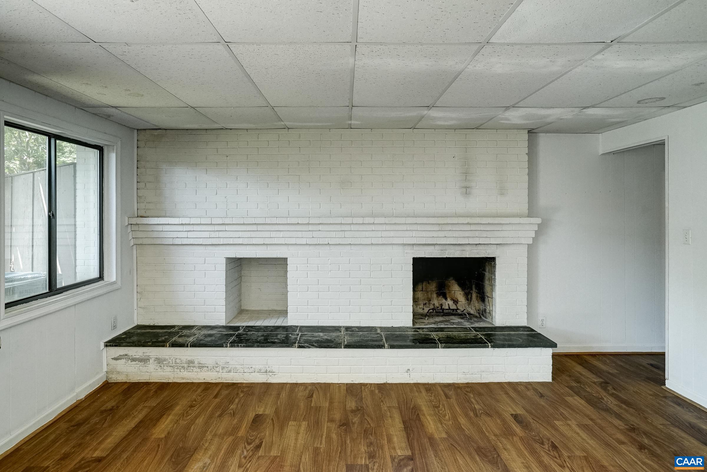 Wood burning fireplace in rec room