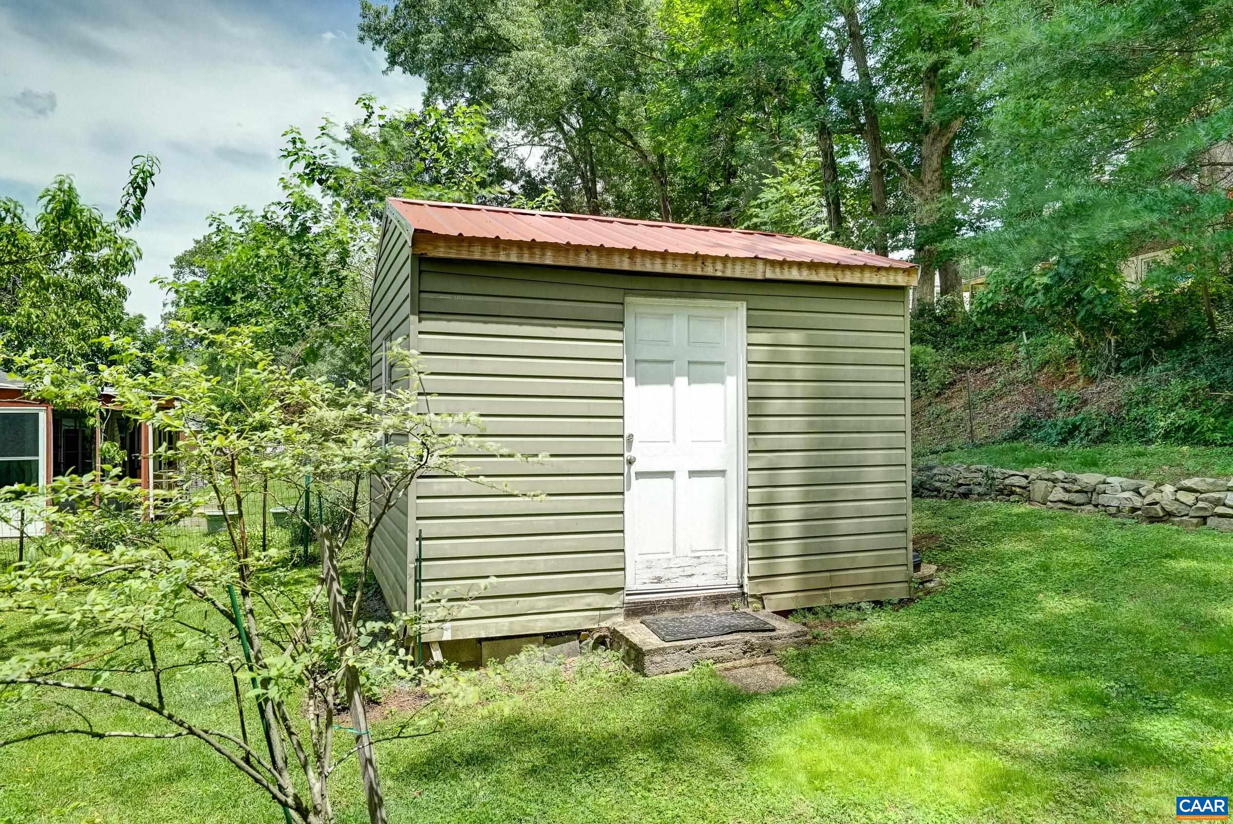 Storage shed in back yard for outdoor tools and equipment.