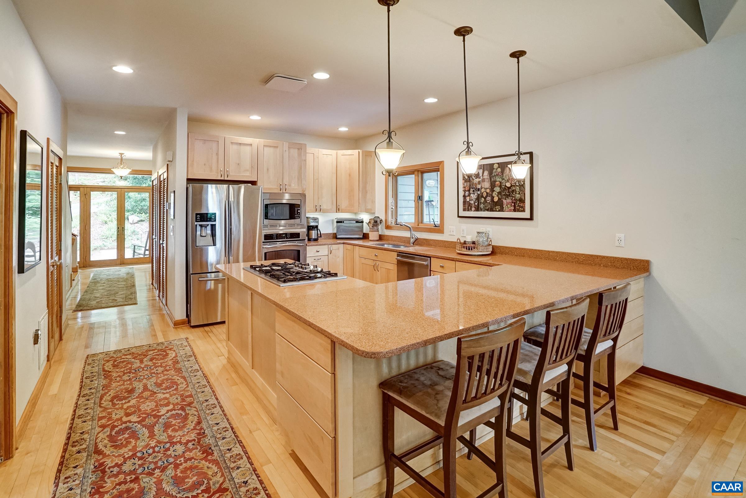 Large bar area is great for entertaining or enjoying a casual meal.