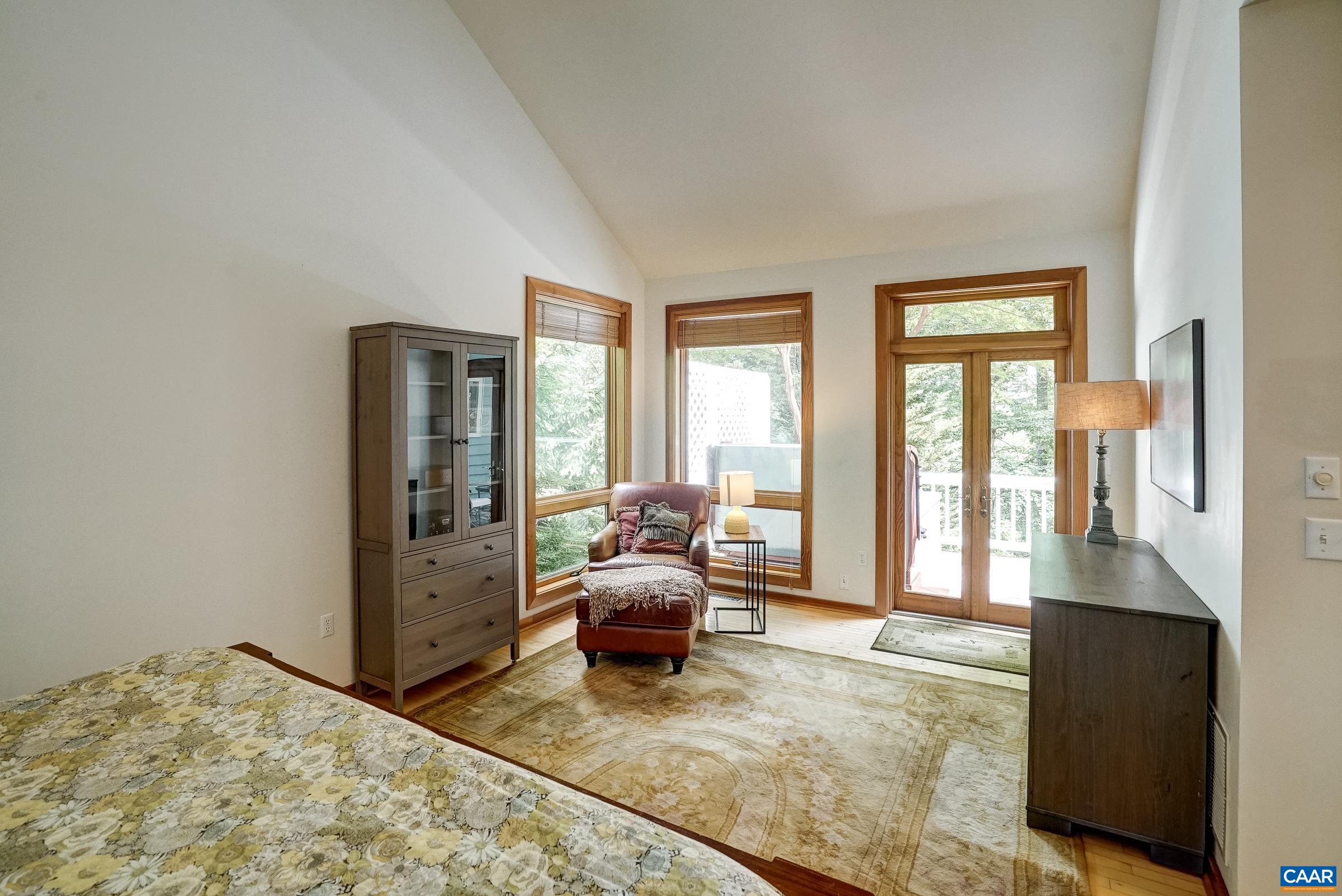 Main level sitting area with french doors leading to private balcony.