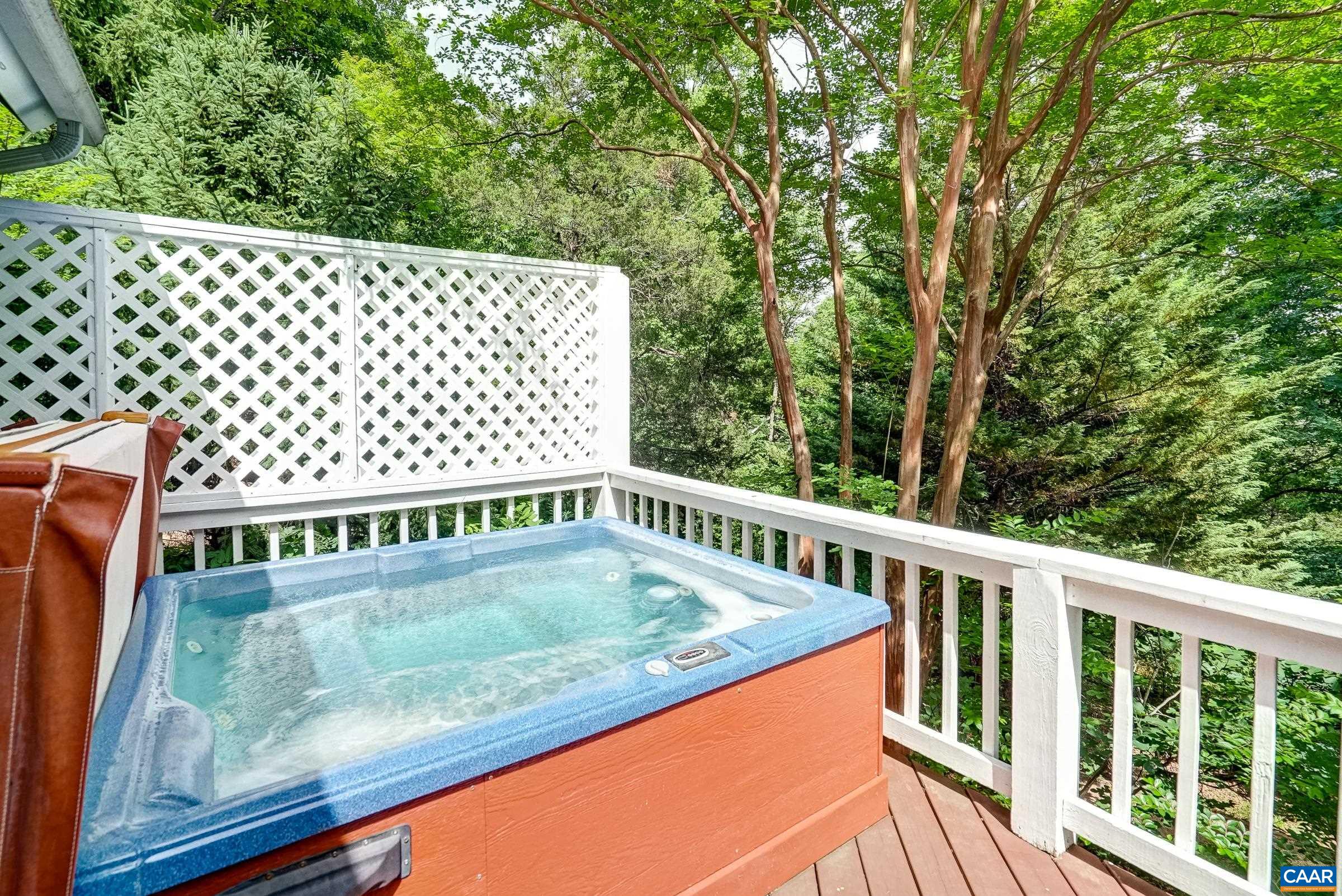 Relax your cares away in the private hot tub.
