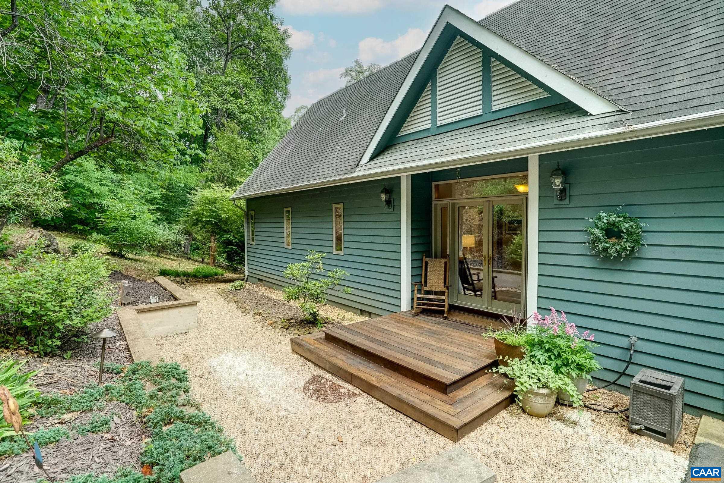 Welcoming front steps with well maintained landscaping.
