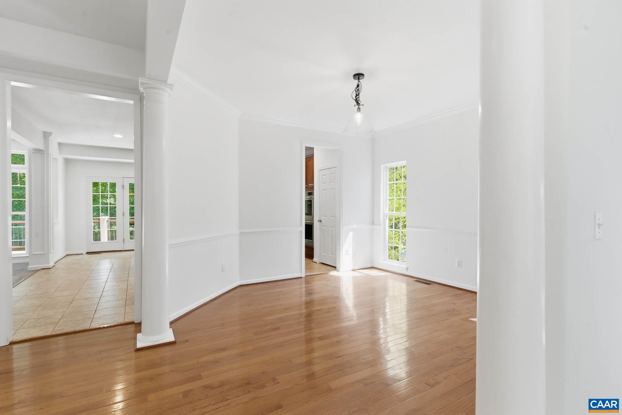 Dining room, kitchen and adjacent living areas.