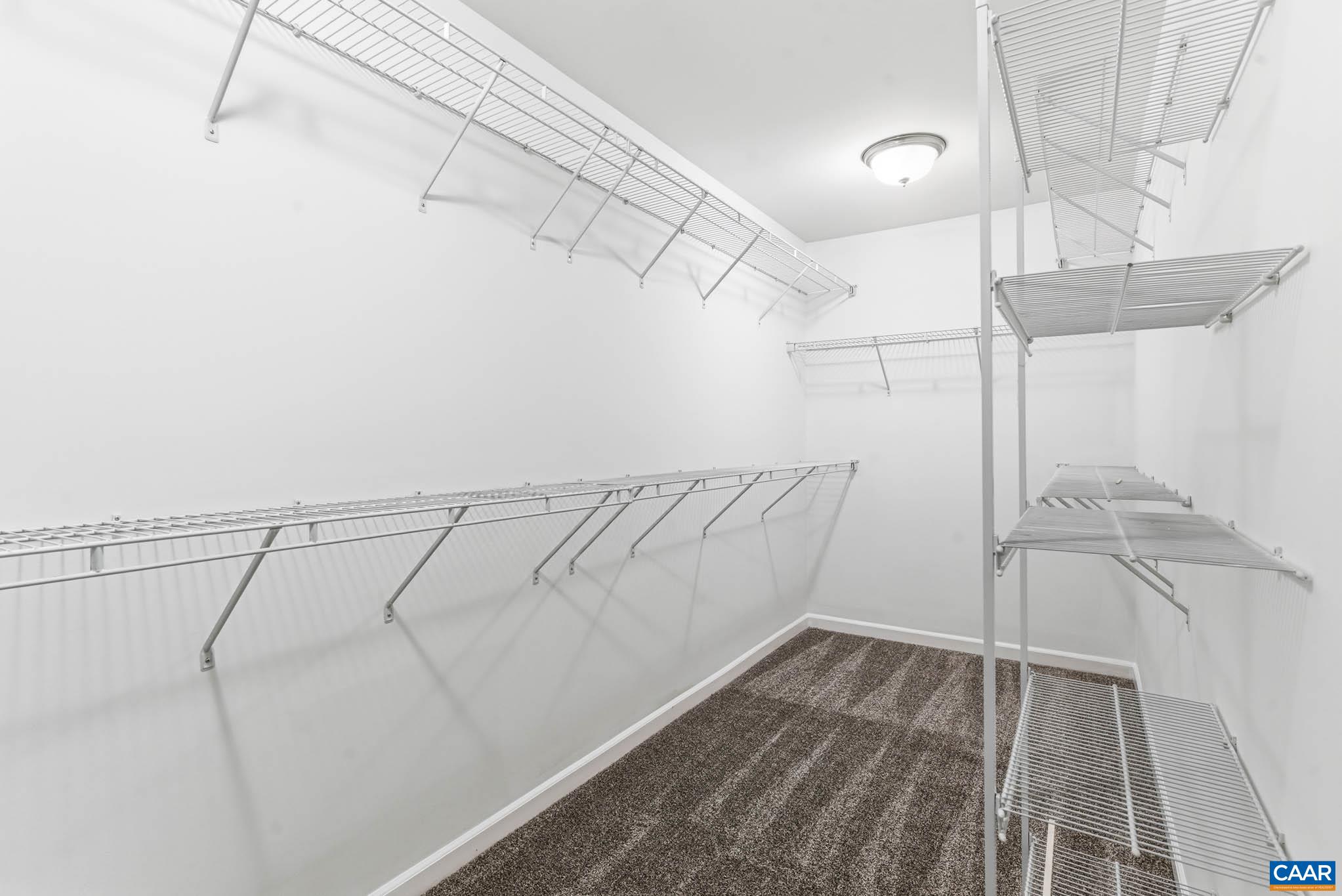 Large walk-in closet large enough for everyone's needs.