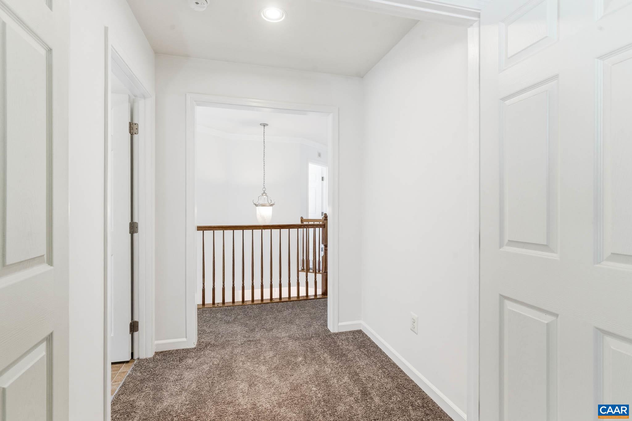 Lockable double door entrance to the primary suite with laundry room on the left.