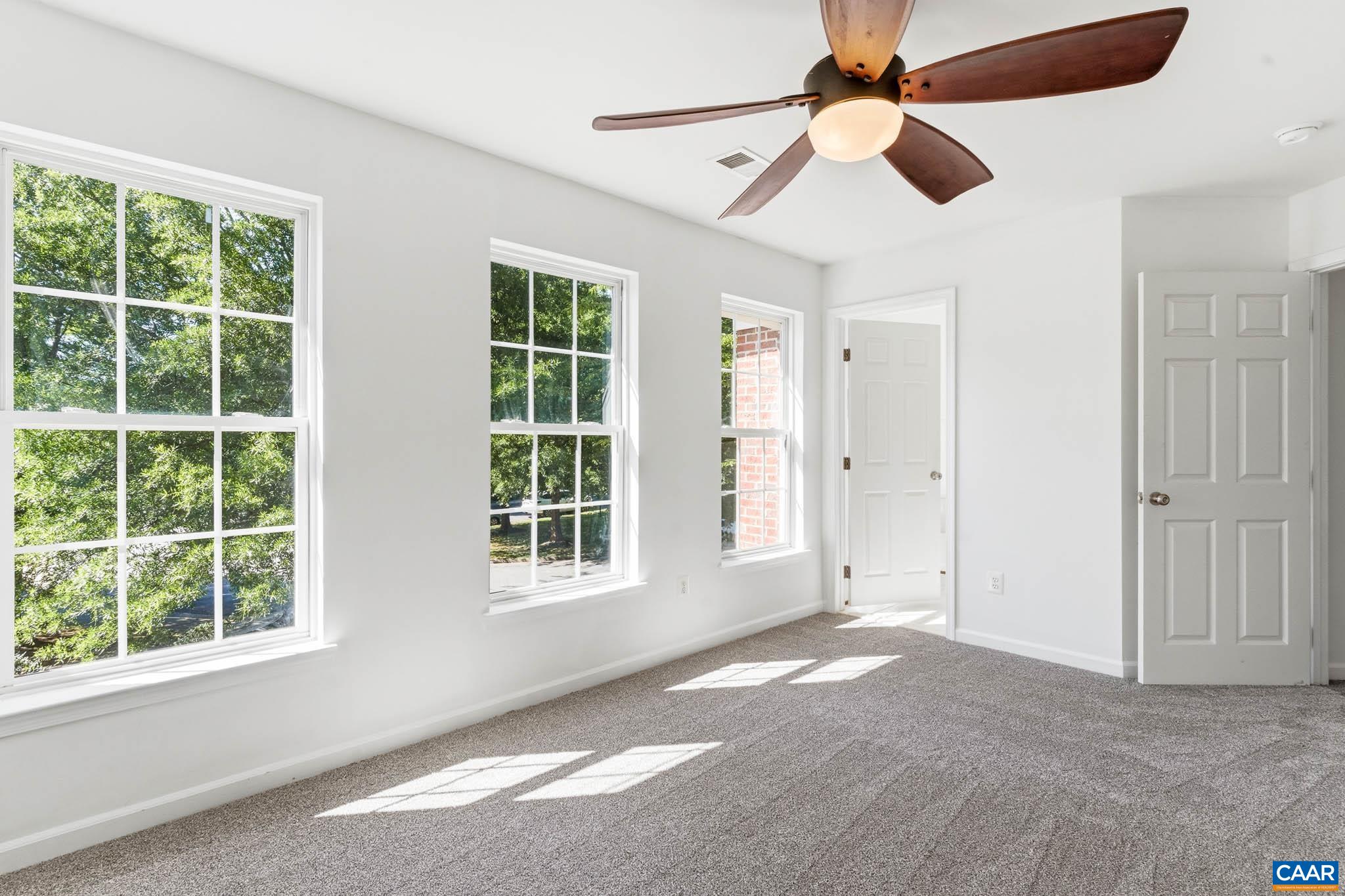 Large secondary bedroom with natural light and dedicated ensuite bathroom.