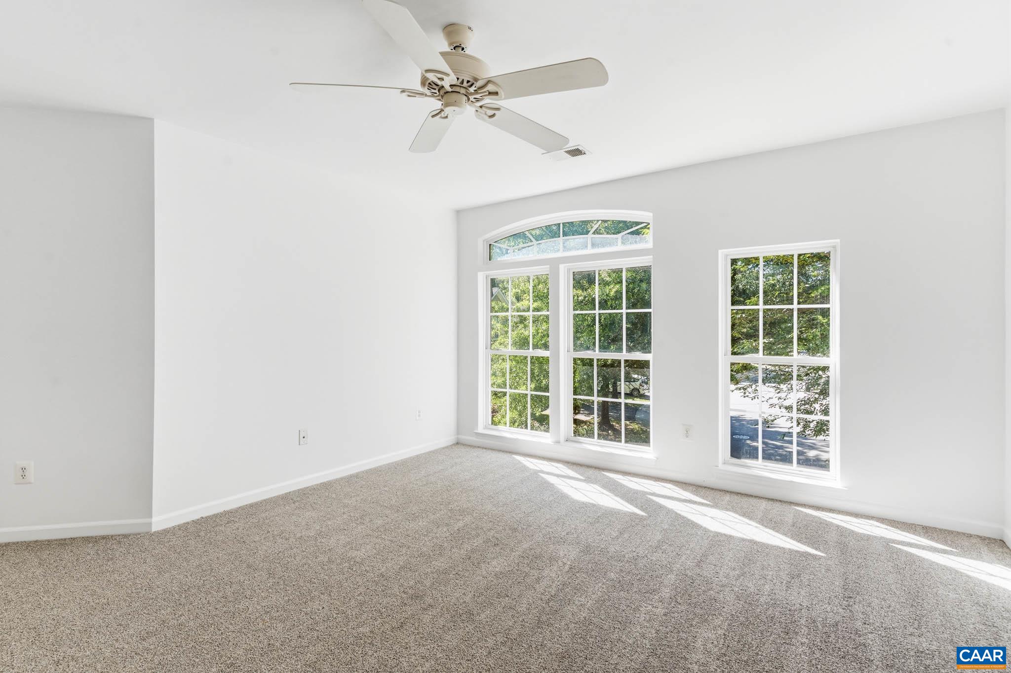 Second secondary bedroom with expansive windows for natural light.