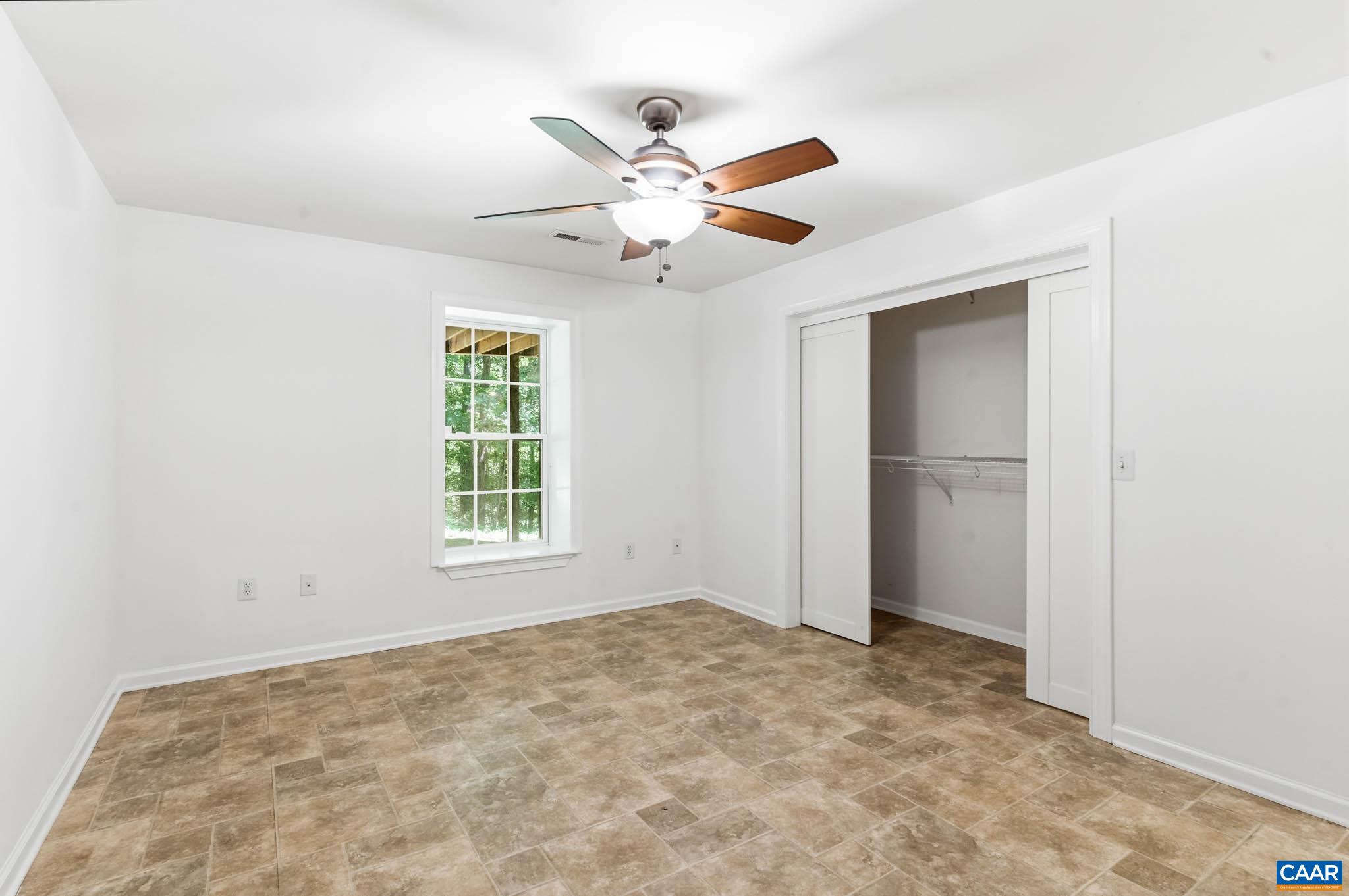 Finished terrace-level bedroom that expands the home's living, guest, and income potential options.