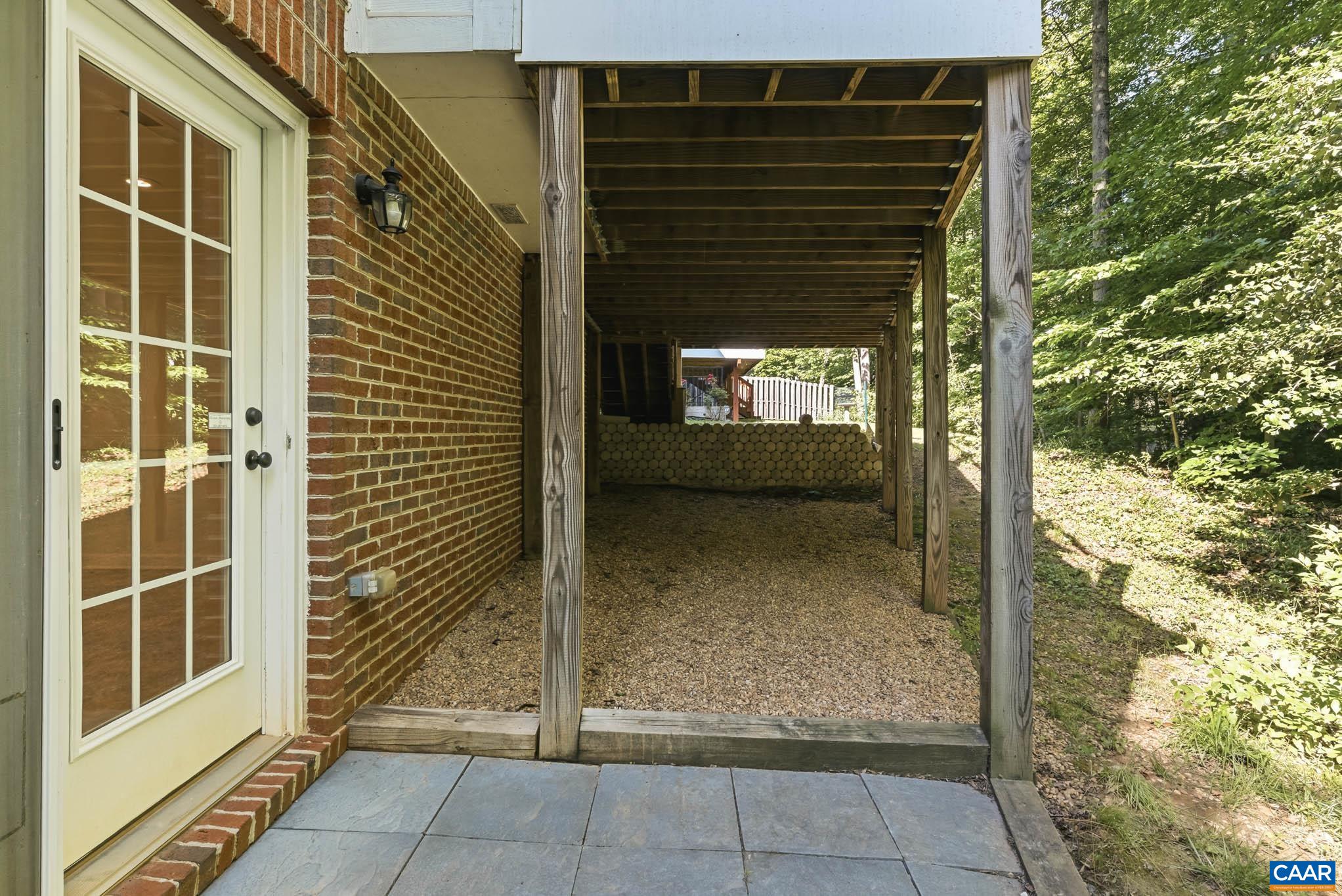 Lower-level exterior access beneath the deck allows for creative use options for the terrace.