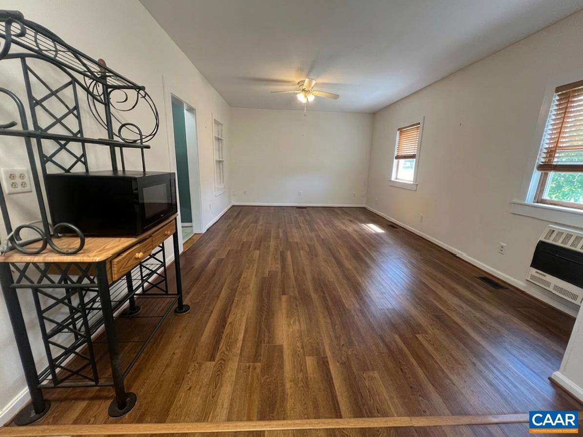 Once you pass the bathroom and laundry room, you'll enter the living room.