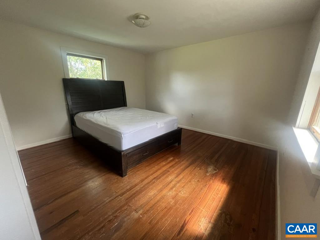 Upstairs at the end of the short hallway is the main bedroom.