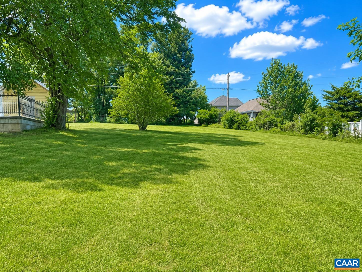 There is ample space in the side yard, next to the yellow shed.