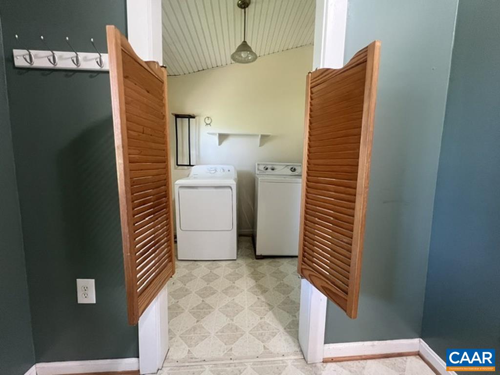 When you step through the front door, look to your left. There is the laundry room.