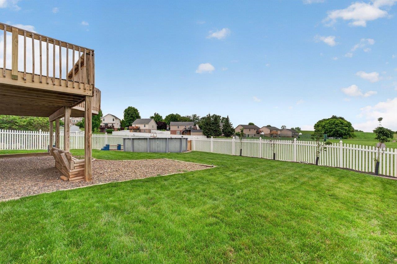 the backyard is improved by a vinyl fence the backyard is improved by a vinyl fence