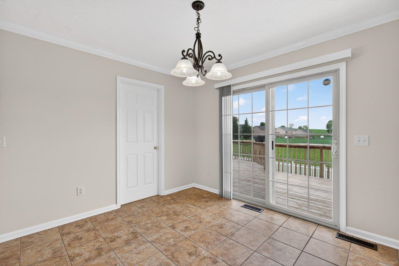 Tile floors and opens up to the rear deck area Tile floors and opens up to the rear deck area
