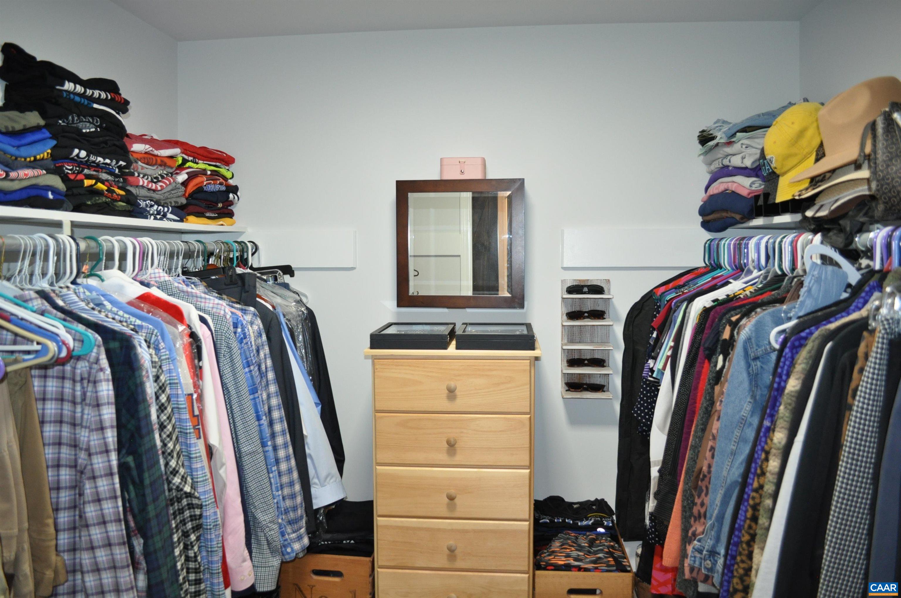 Primary walk-in closet Primary walk-in closet