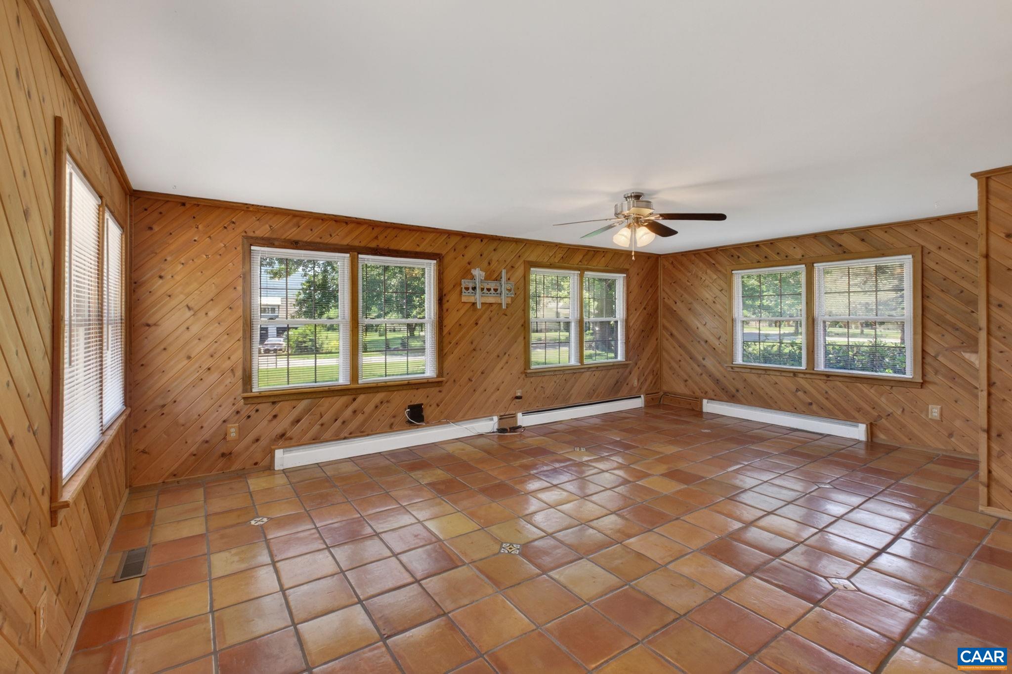 Large and bright tiled family room.