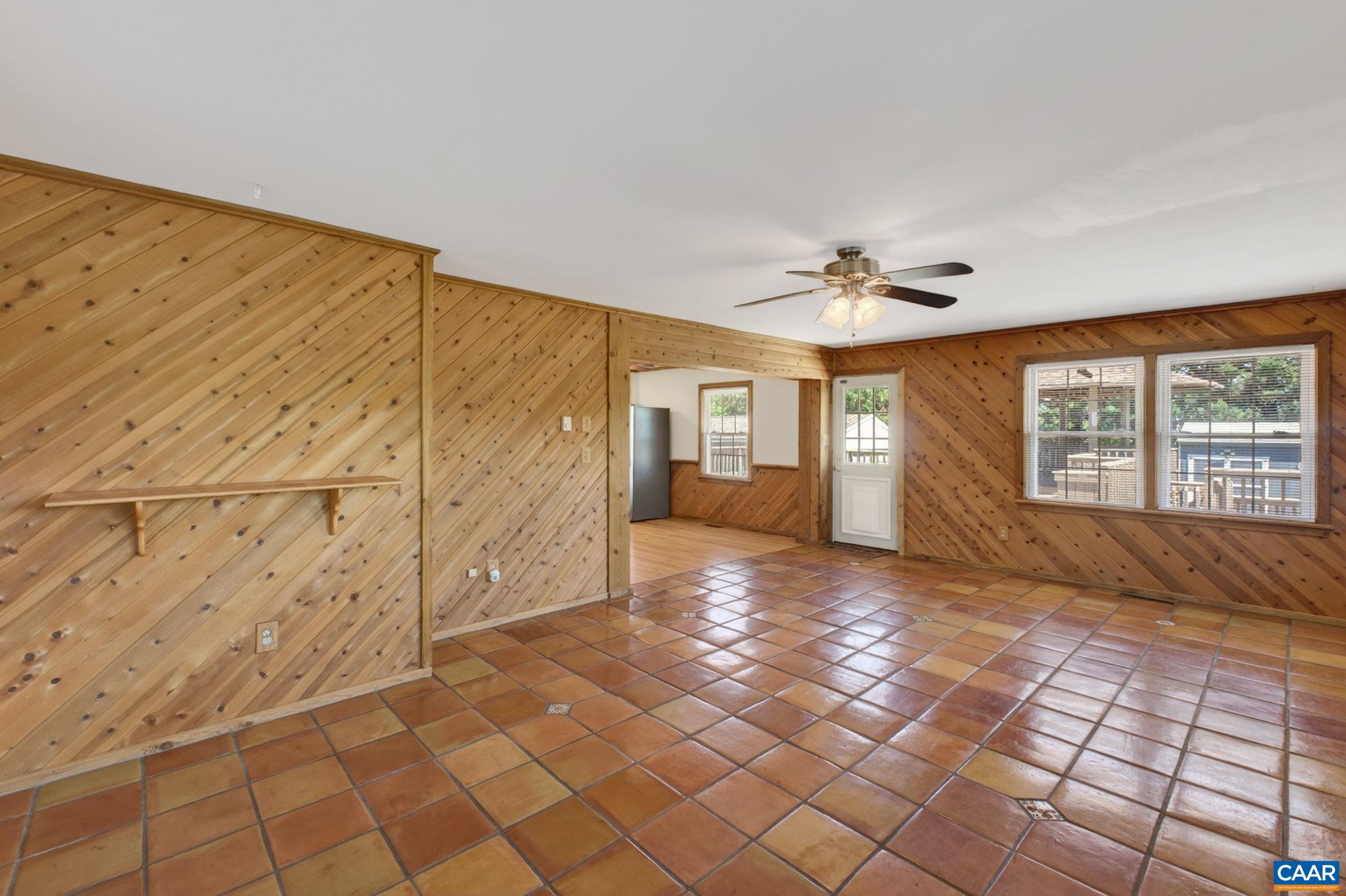 Lovely pine paneling in the family room, and door to the deck.