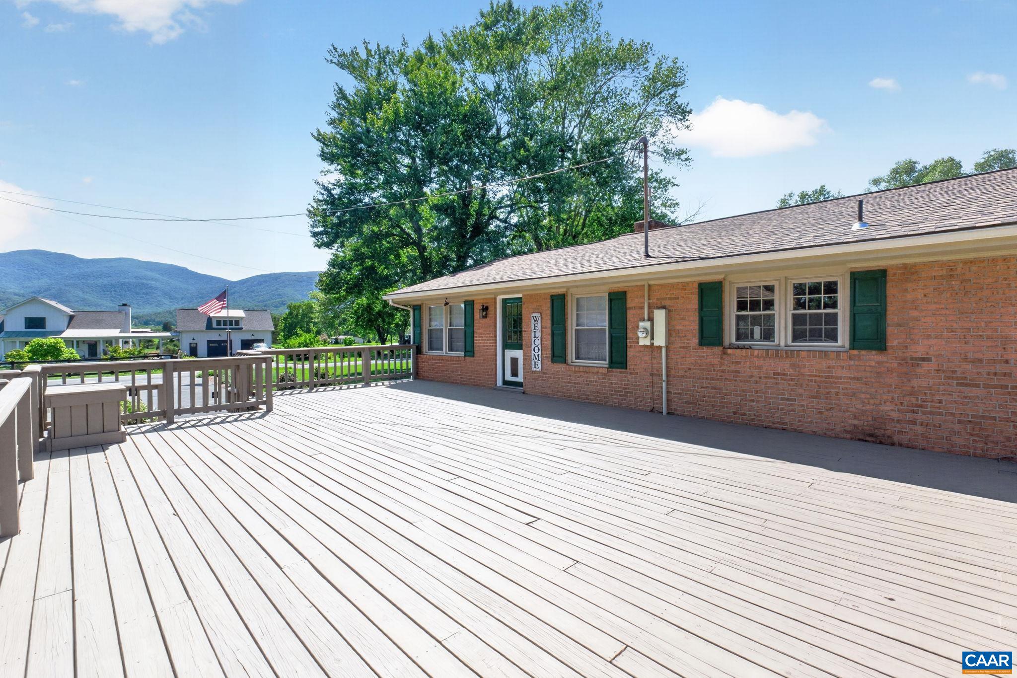 Family room door leads out to the deck, which is a three season room bathed in mountain views!