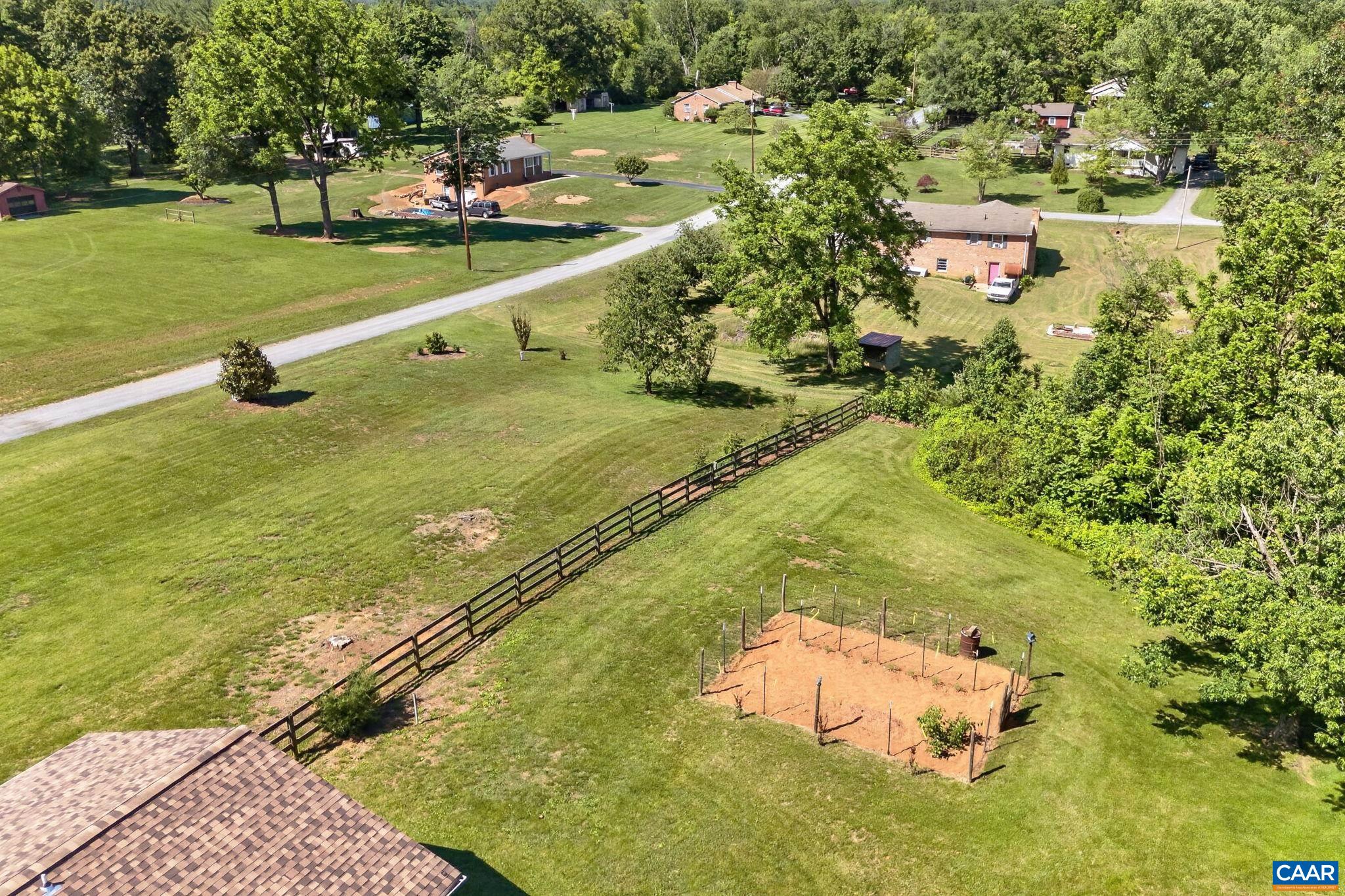 Fully fenced yard, additional invisible fence, and garden spot.