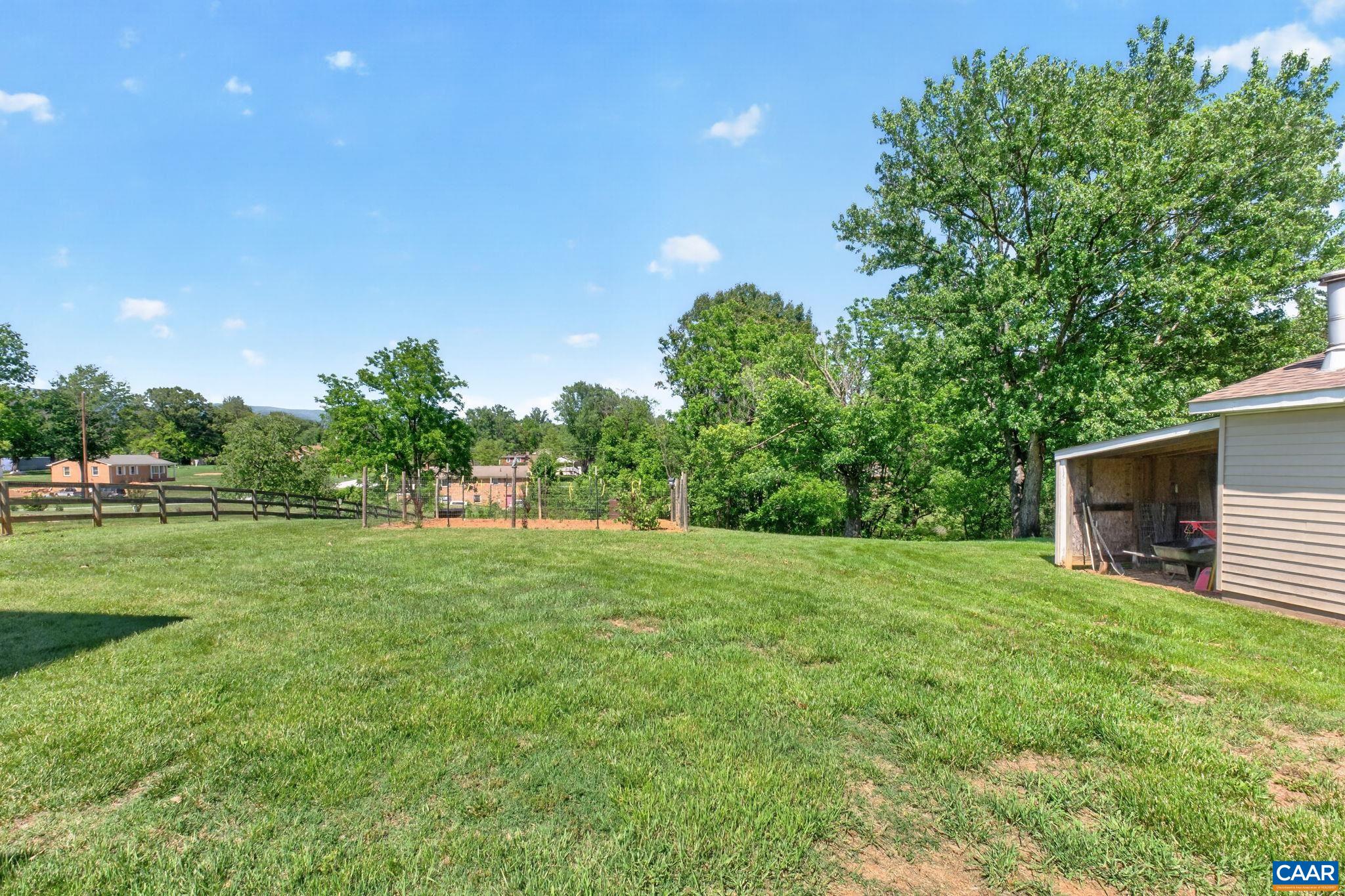 Large, level and sunny backyard.