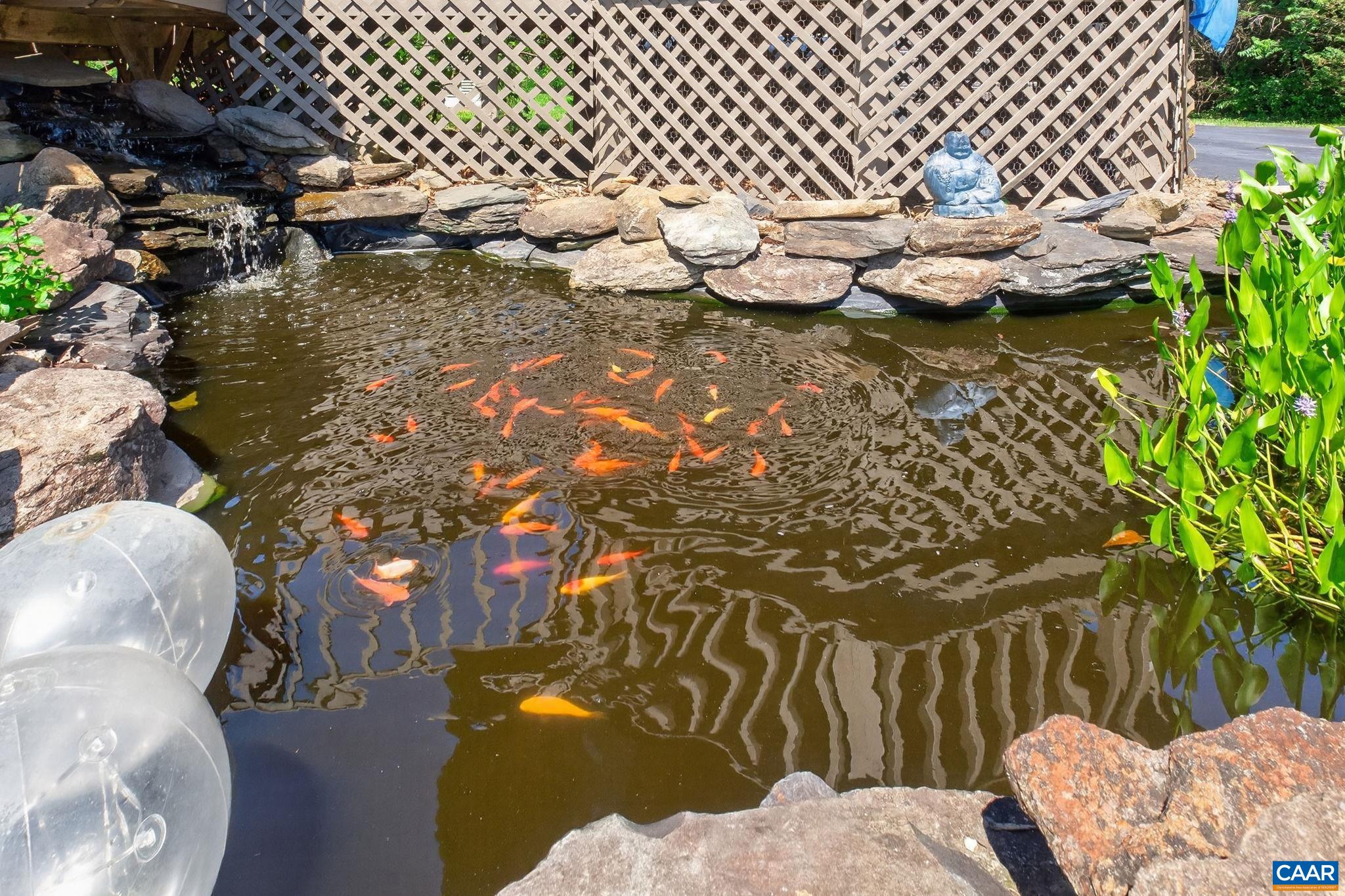 Lovely stone fish pond with waterfall.