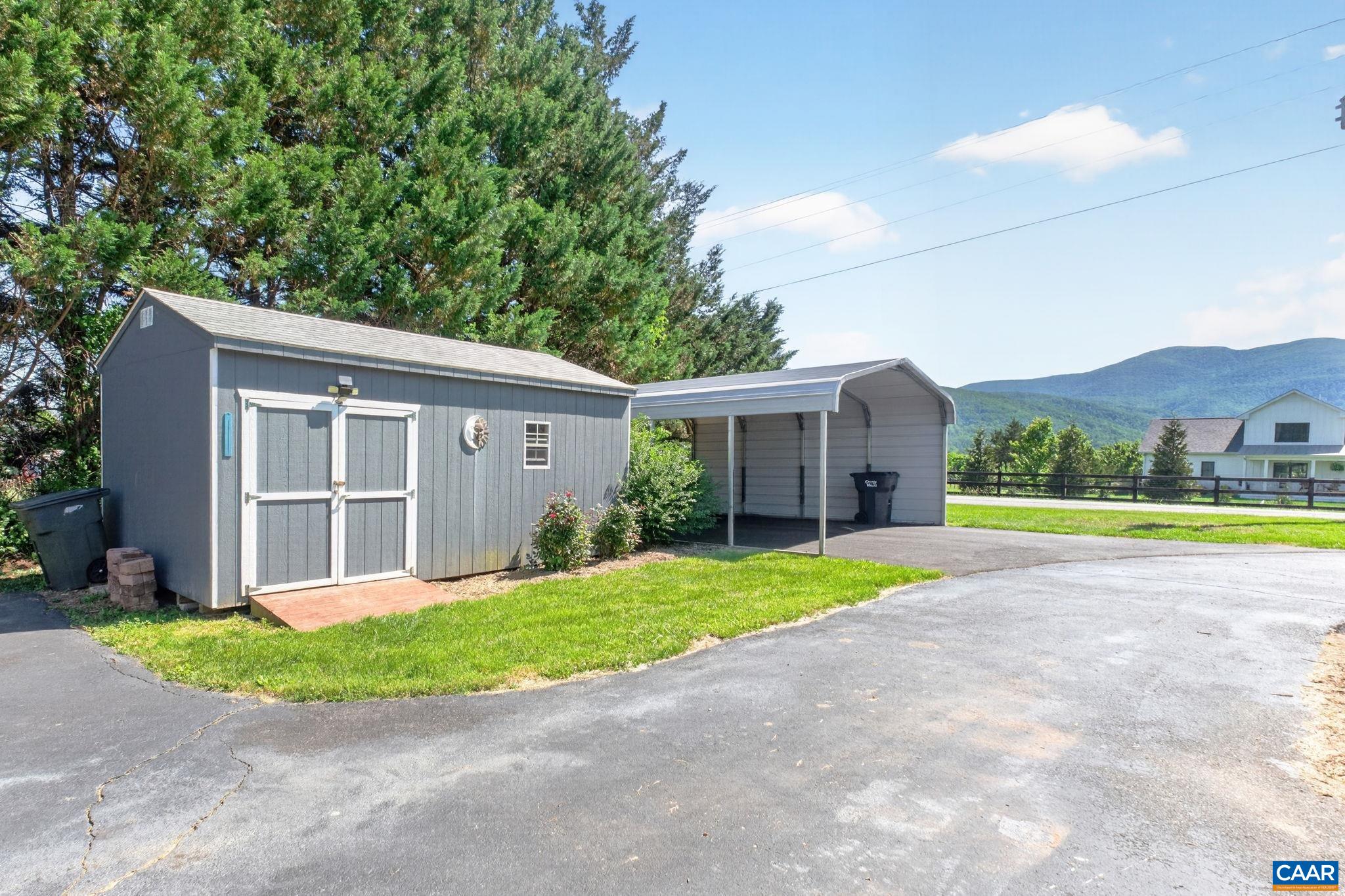 Shed and new carport. Lots of off street parking.