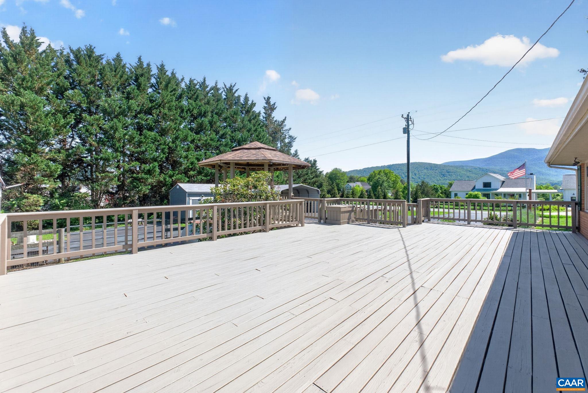 Back deck with attached gazebo has gorgeous mountain views. Deck newly sealed and gazebo roof one year old.