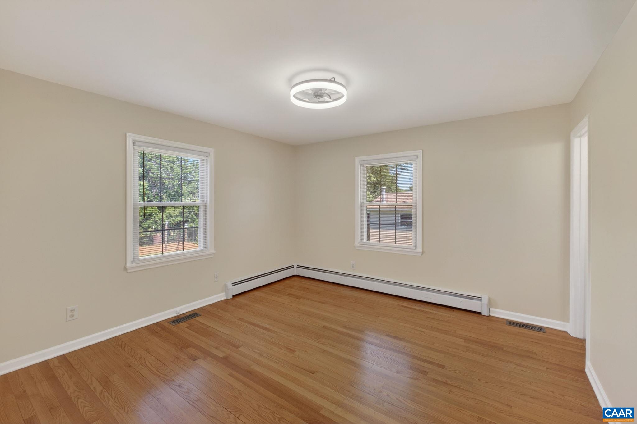 Large main level primary bedroom with attached bath.