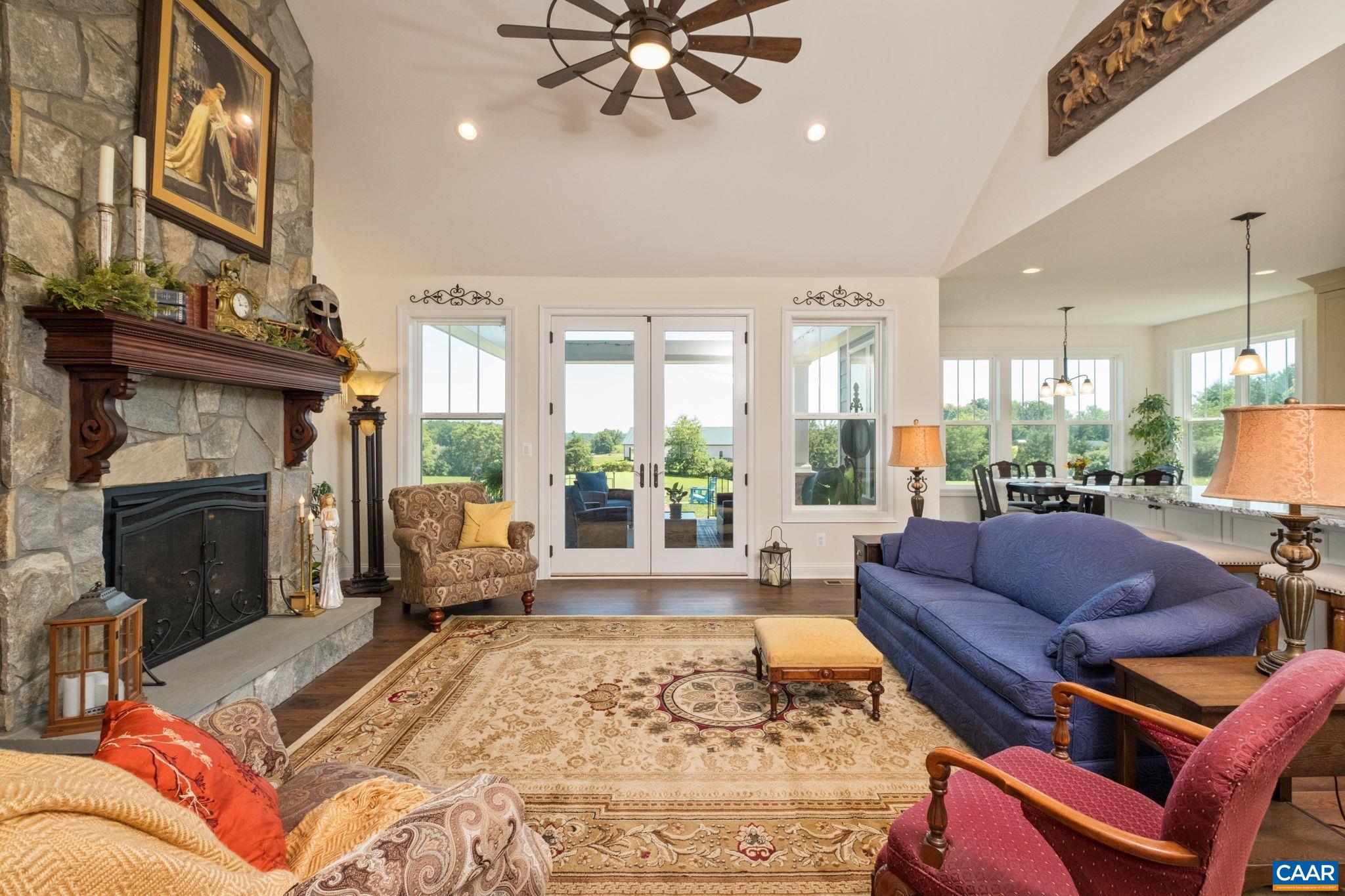 Just beyond the foyer you see the living room, with views of the covered porch and mountains beyond. Just beyond the foyer you see the living room, with views of the covered porch and mountains beyond.