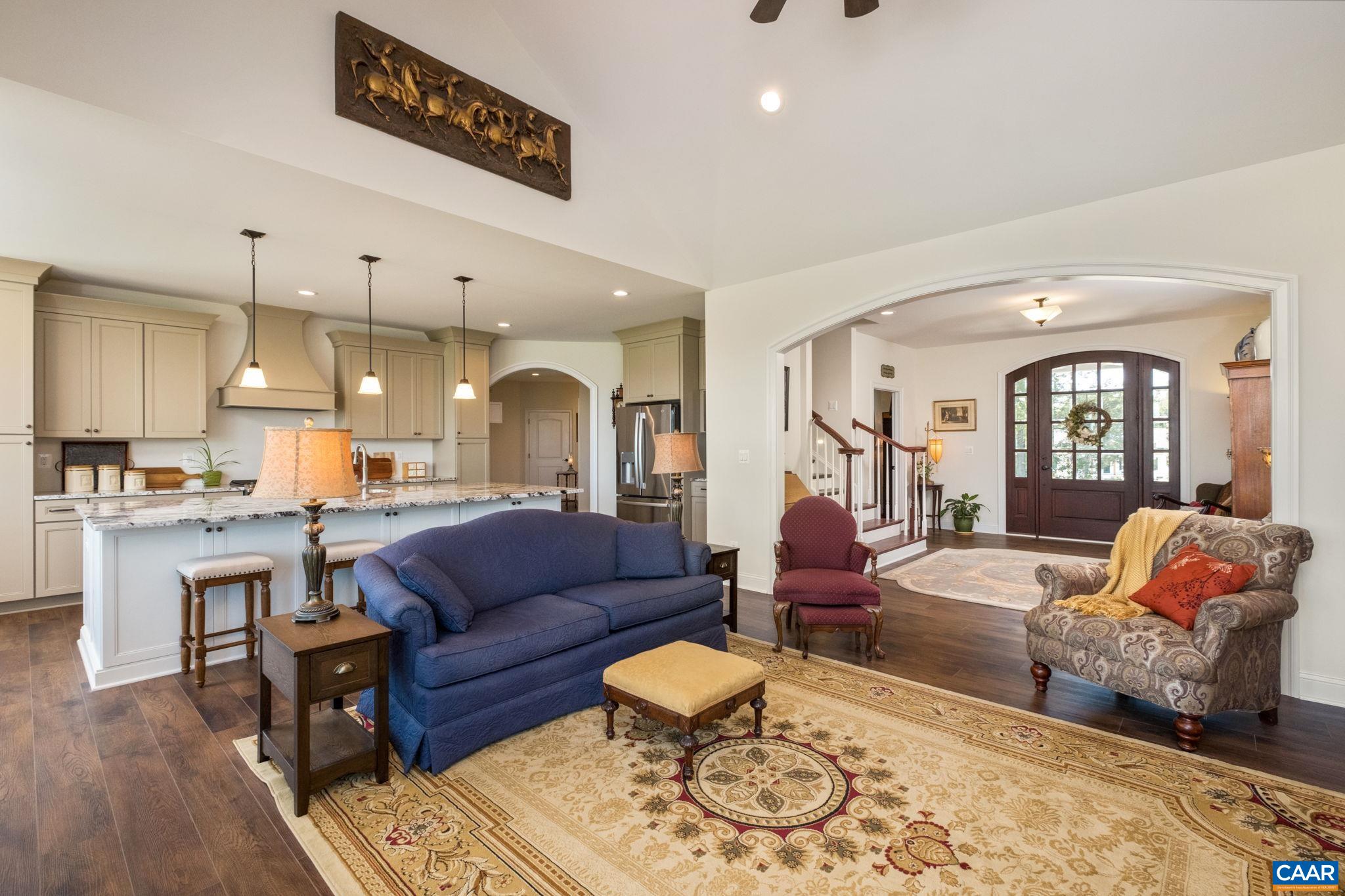 This view is from the living room and covered back porch to the kitchen. This view is from the living room and covered back porch to the kitchen.