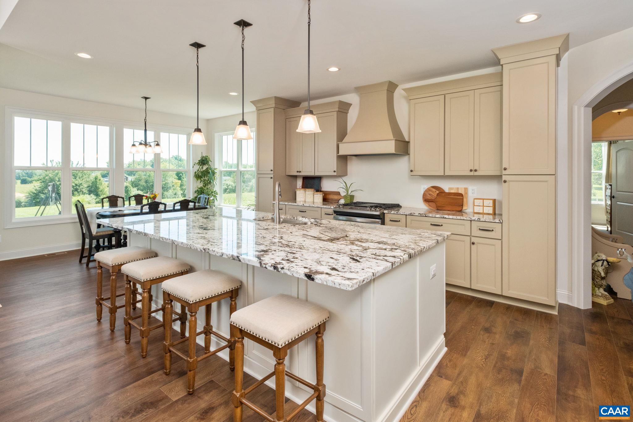 The main living space is open concept with plenty of windows for natural light. The main living space is open concept with plenty of windows for natural light.